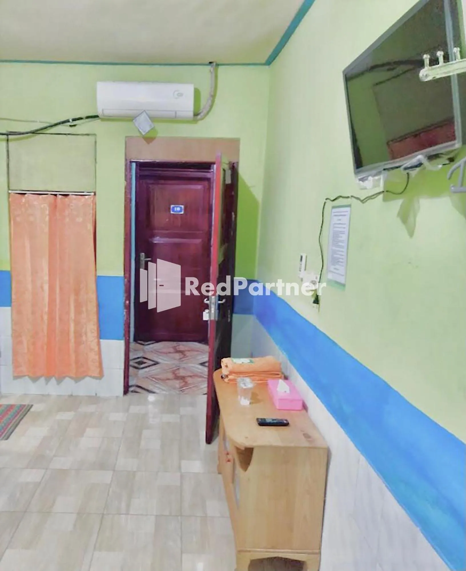 TV and multimedia in Hotel Indah Grogot Syariah Mitra RedDoorz