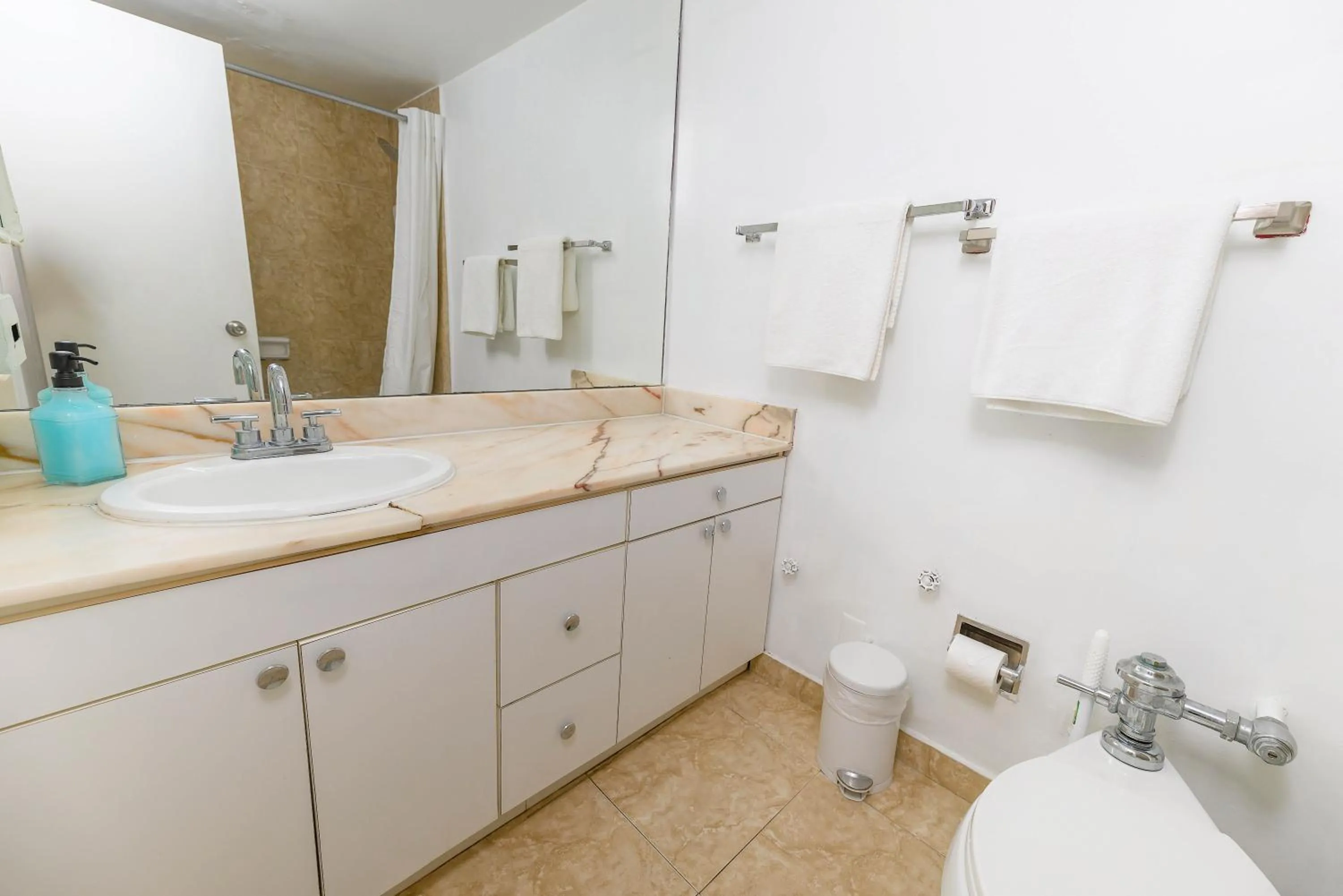 Shower in SeaStays Apartments