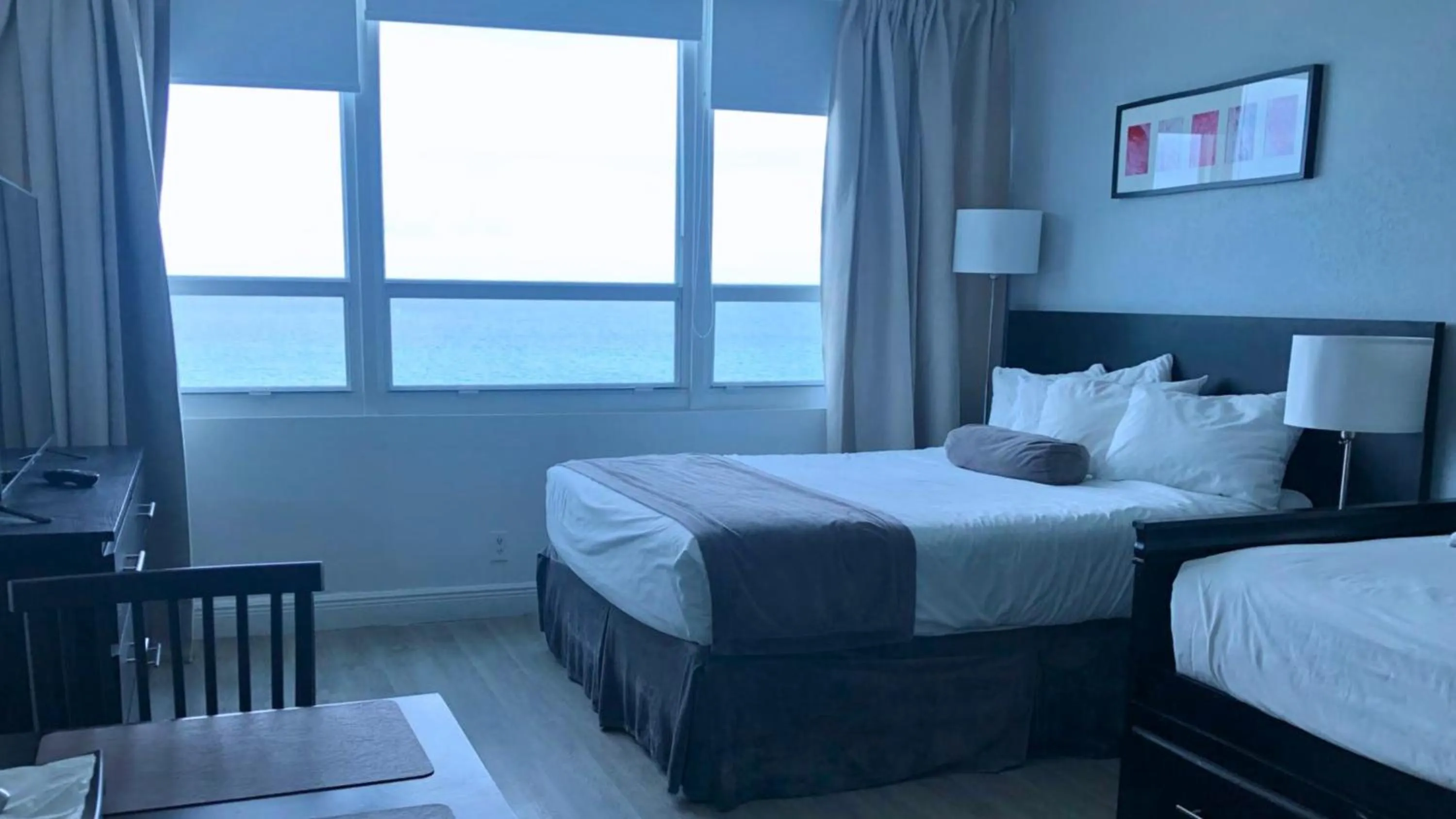 Bed in SeaStays Apartments