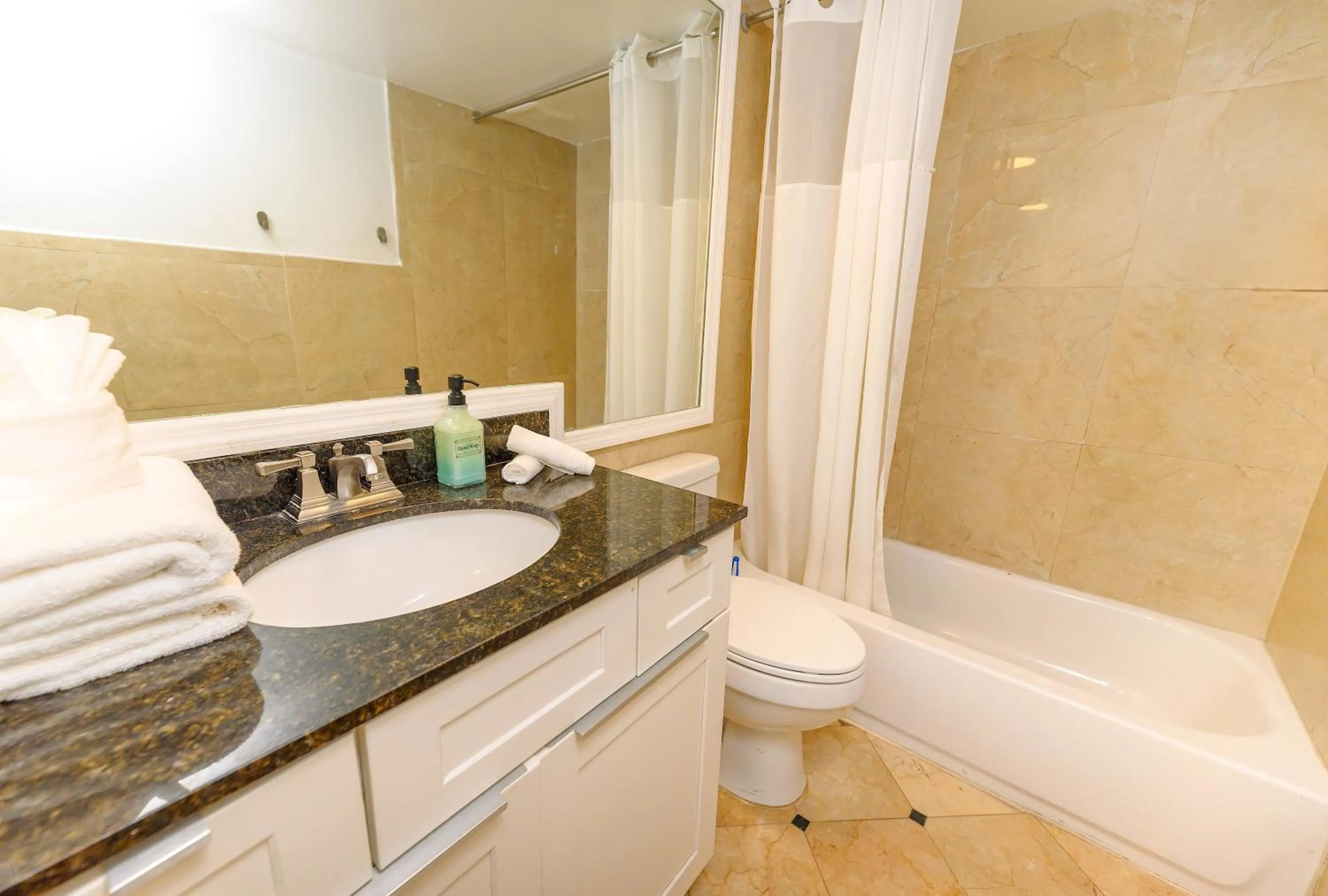 Shower in SeaStays Apartments