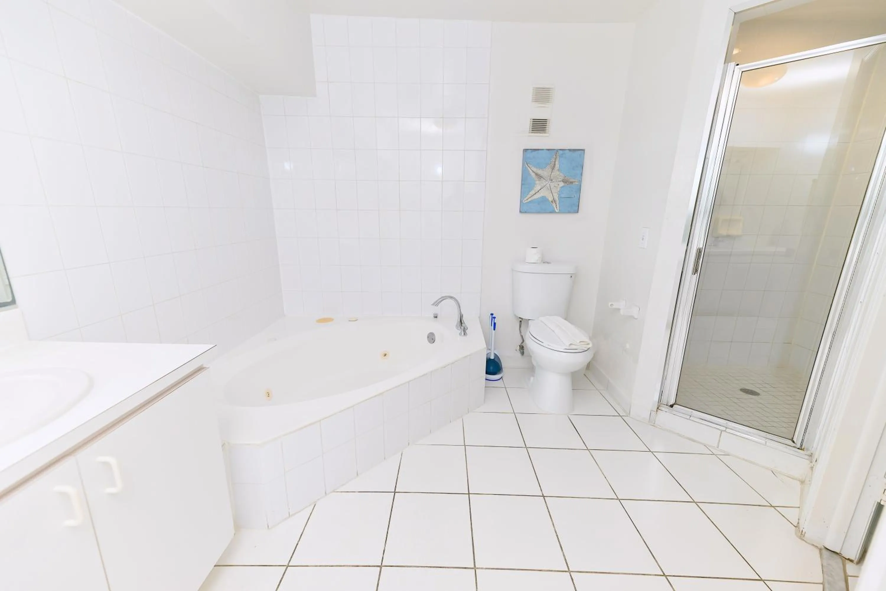 Shower in SeaStays Apartments