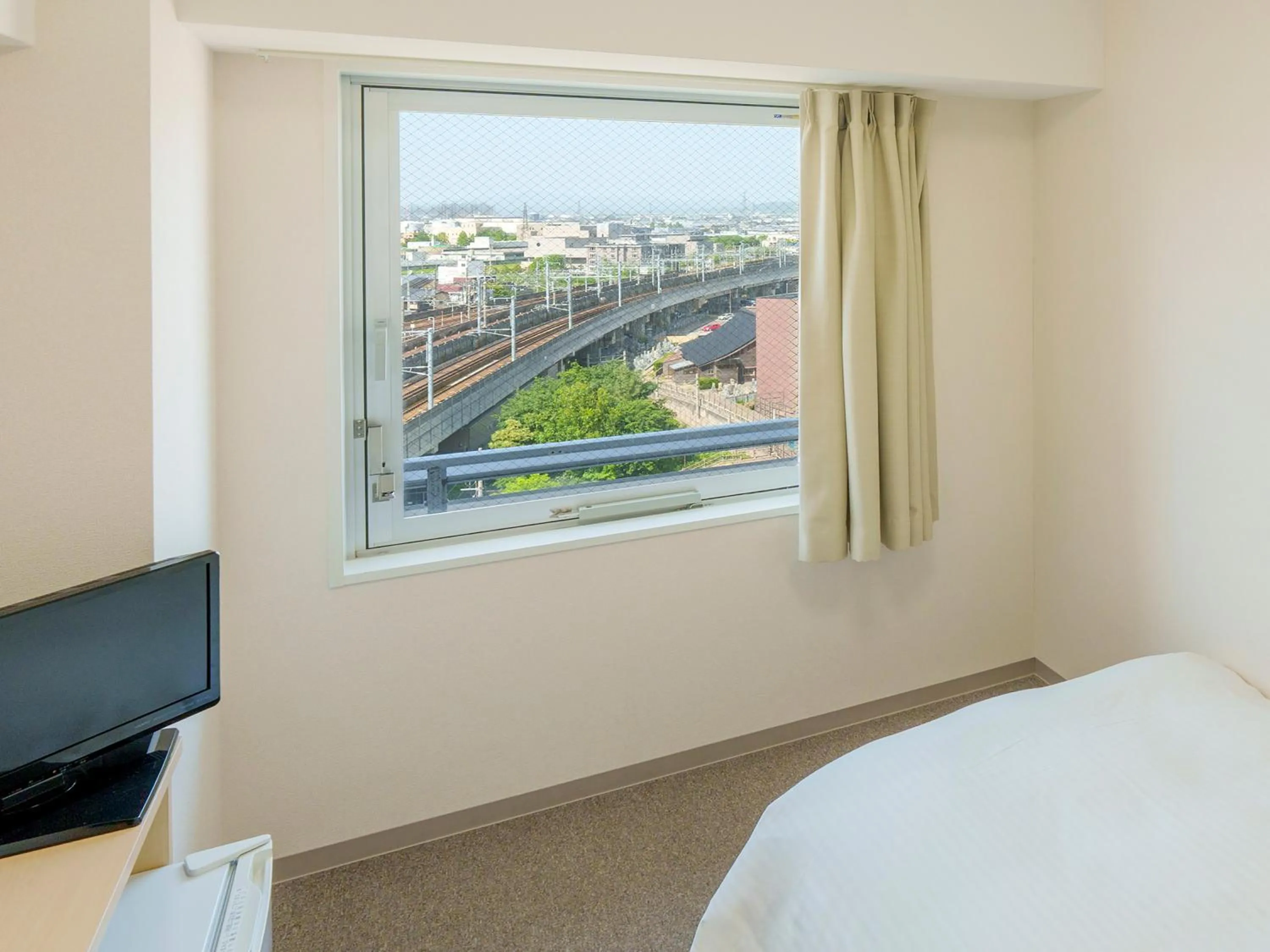 View (from property/room), Bed in CHISUN BUDGET Kanazawa Ekimae