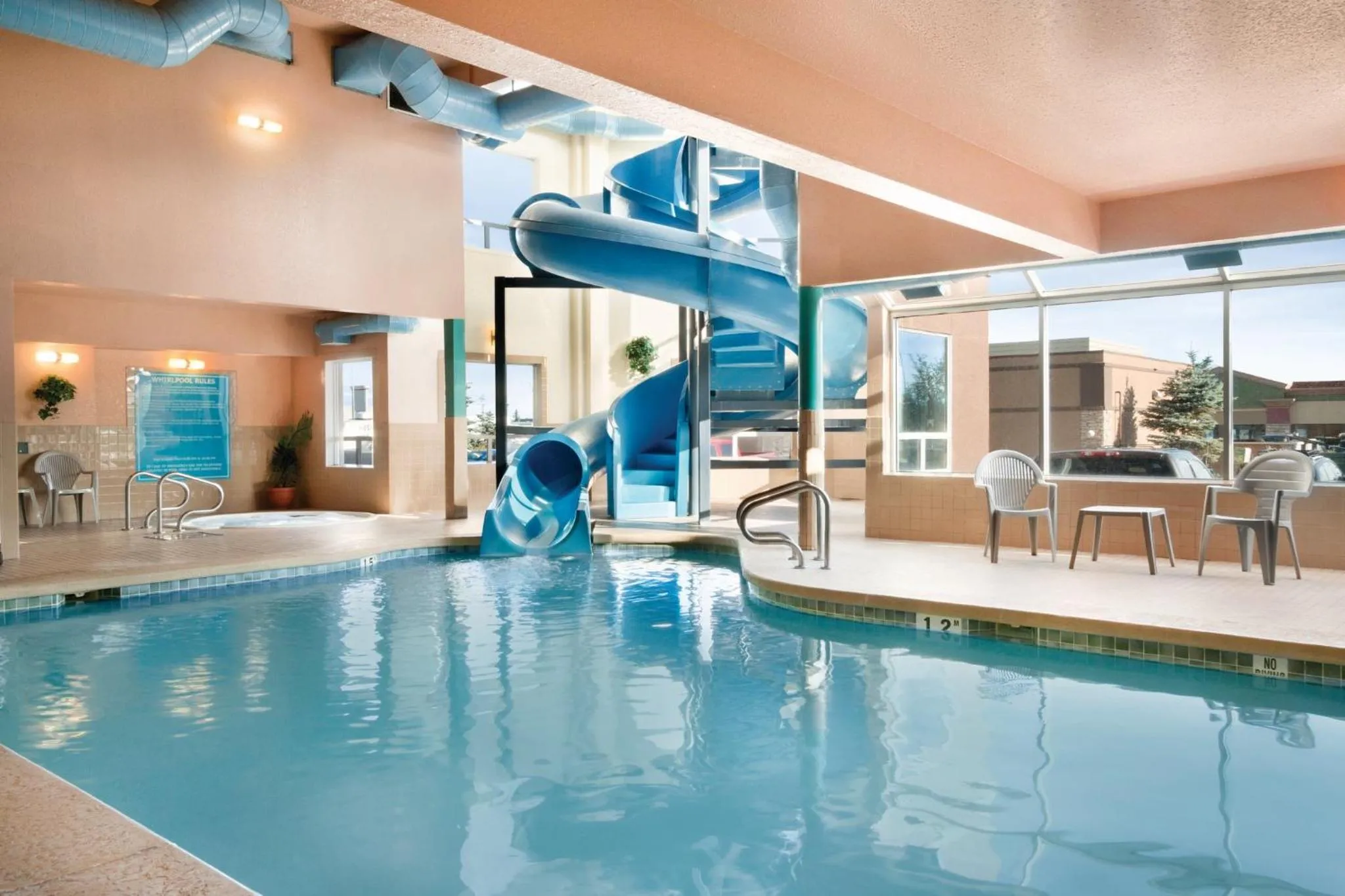 Swimming pool in Prairie Crest Calgary Airport by IHG