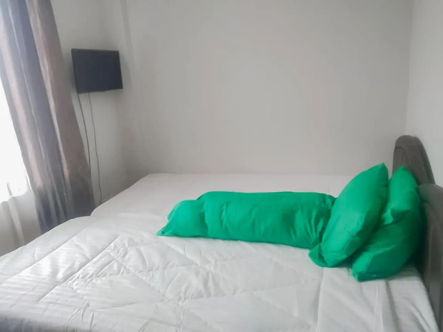 Bed in Colombus Residence Karawang Mitra RedDoorz Bed in Colombus Residence Karawang Mitra RedDoorz