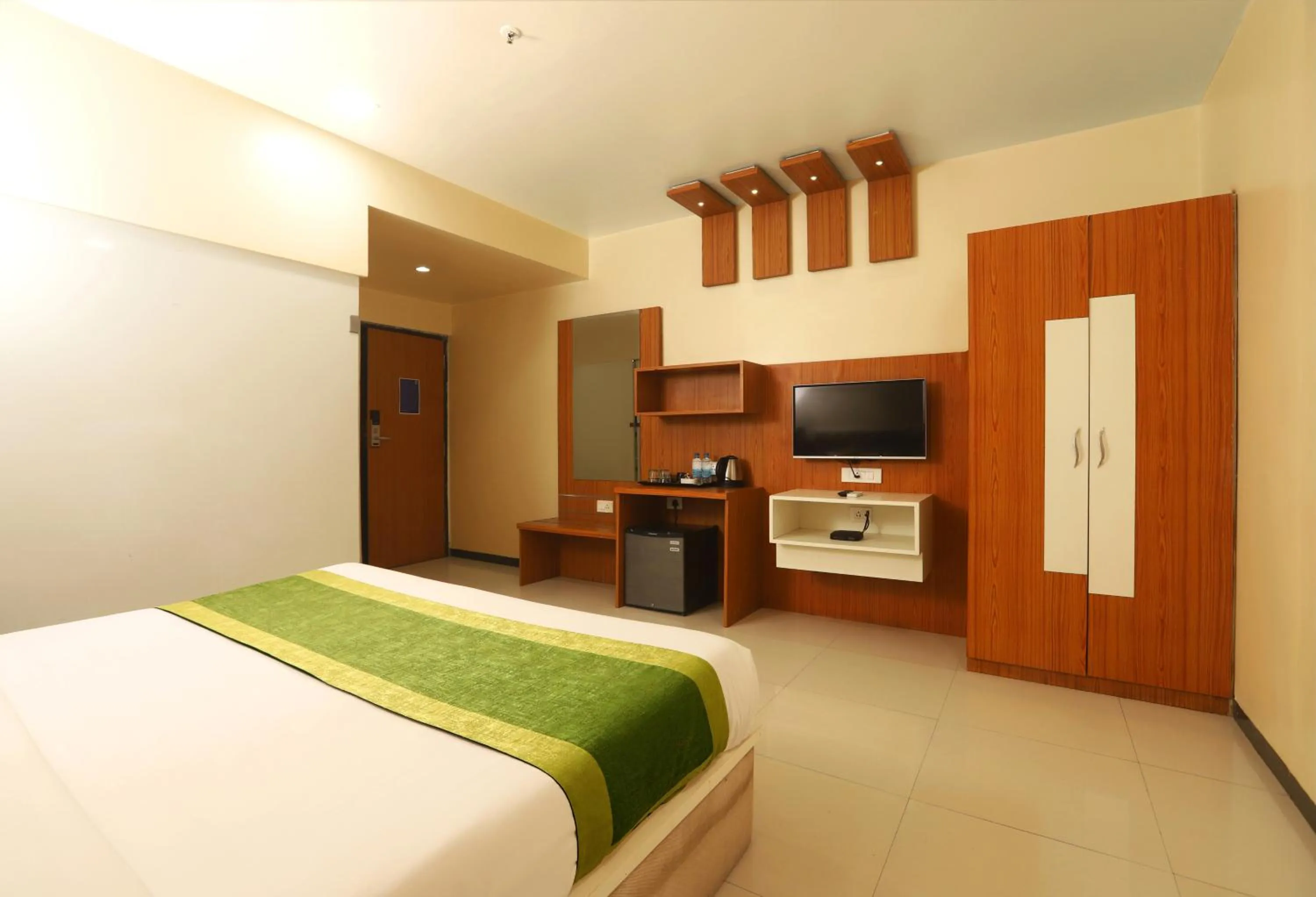 TV and multimedia, Bed in Hotel Elite Continental- Near Mumbai International Airport Andheri East