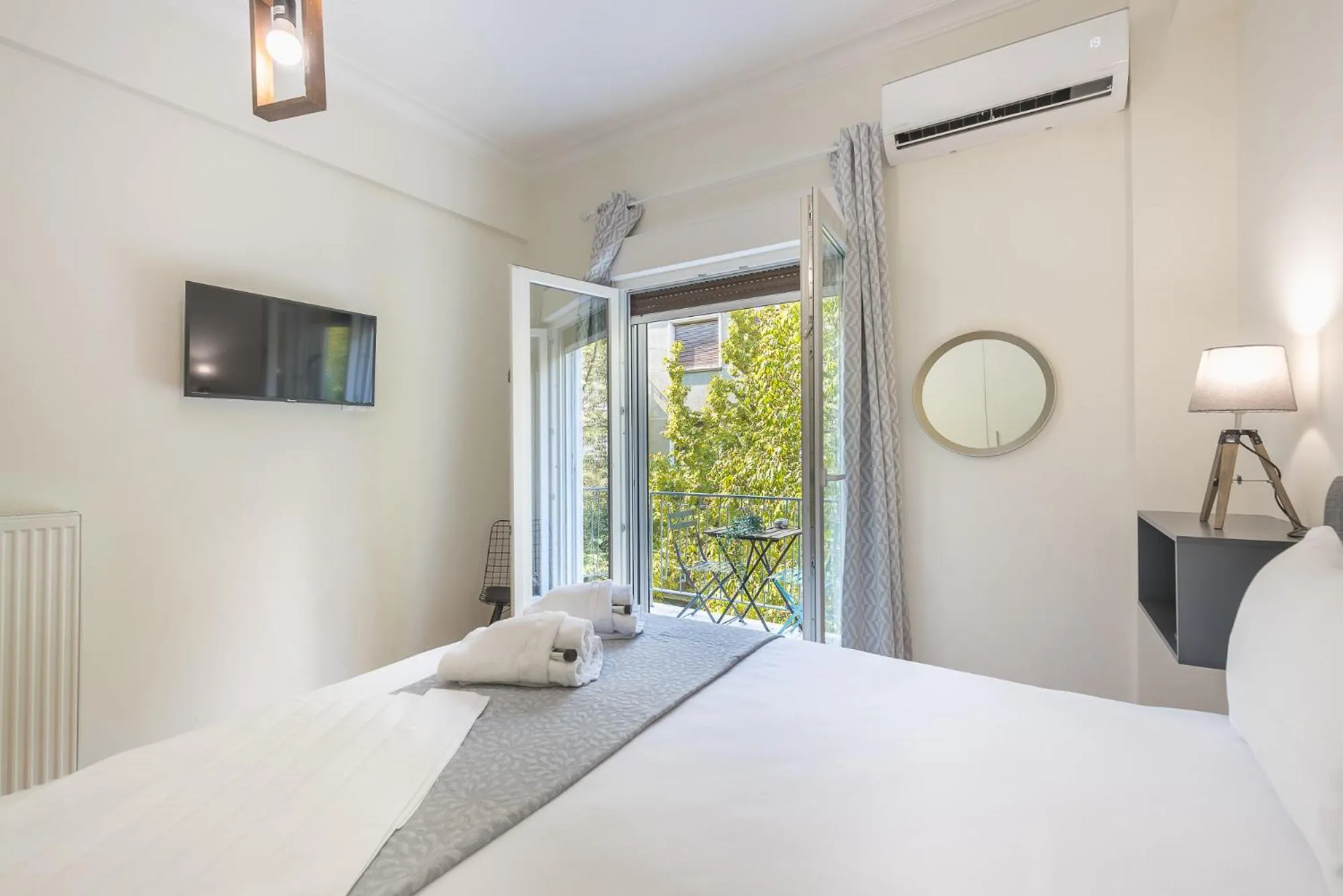 Bed in Elegant Suite by CloudKeys