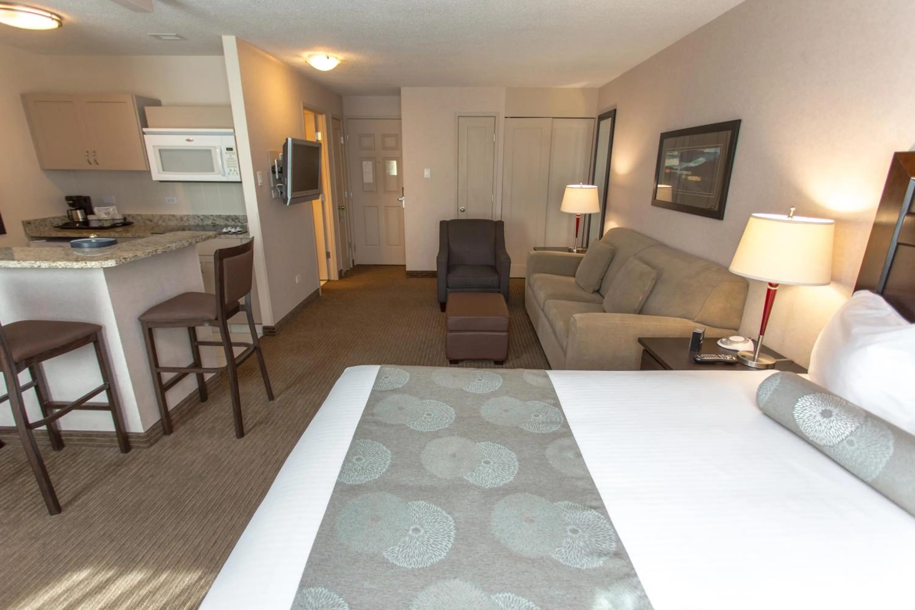 Bed in Campus Tower Suite Hotel