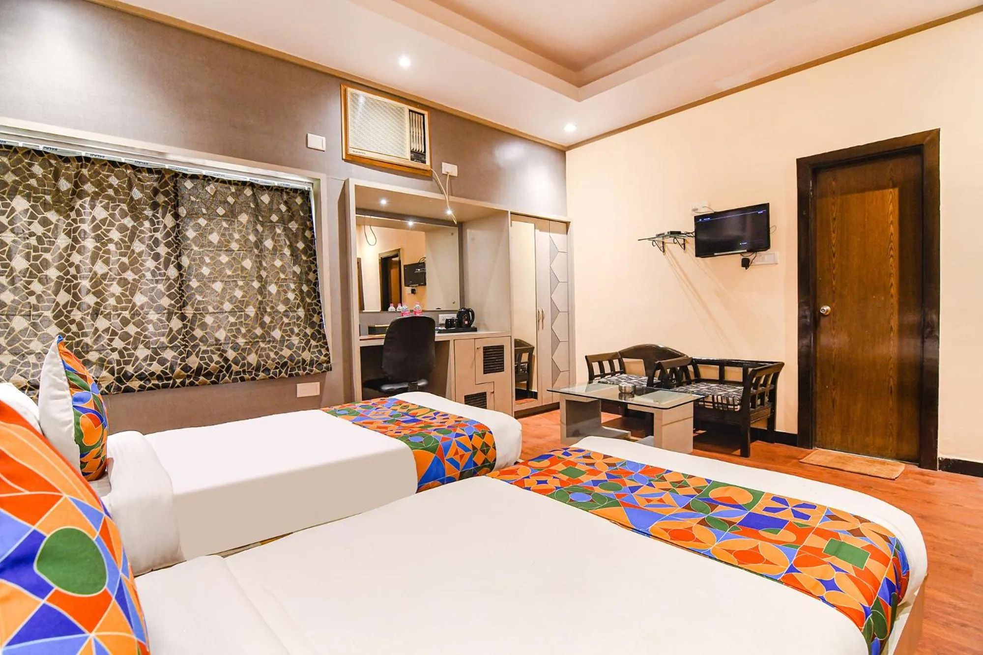 Bed in FabHotel Shivani International