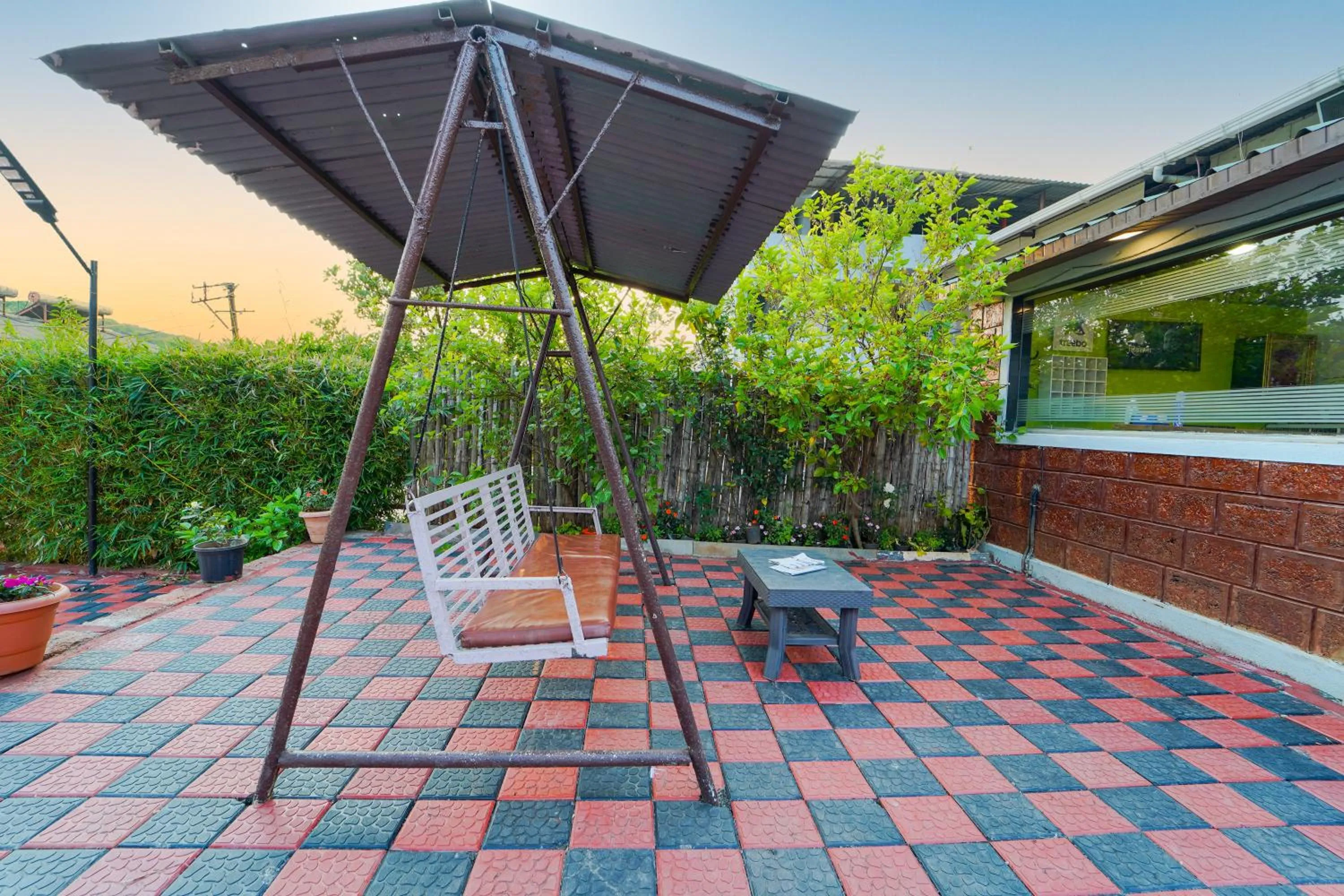 Swimming pool in Treebo La Paradise