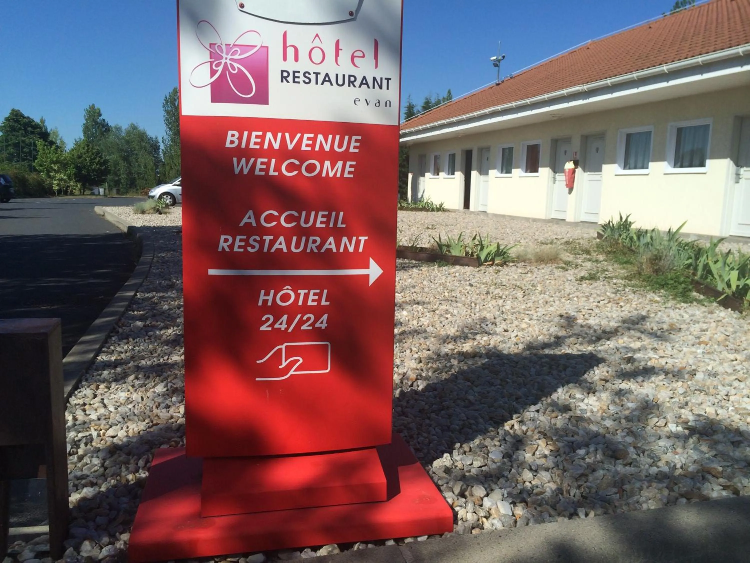 Property logo or sign in Hôtel Evan