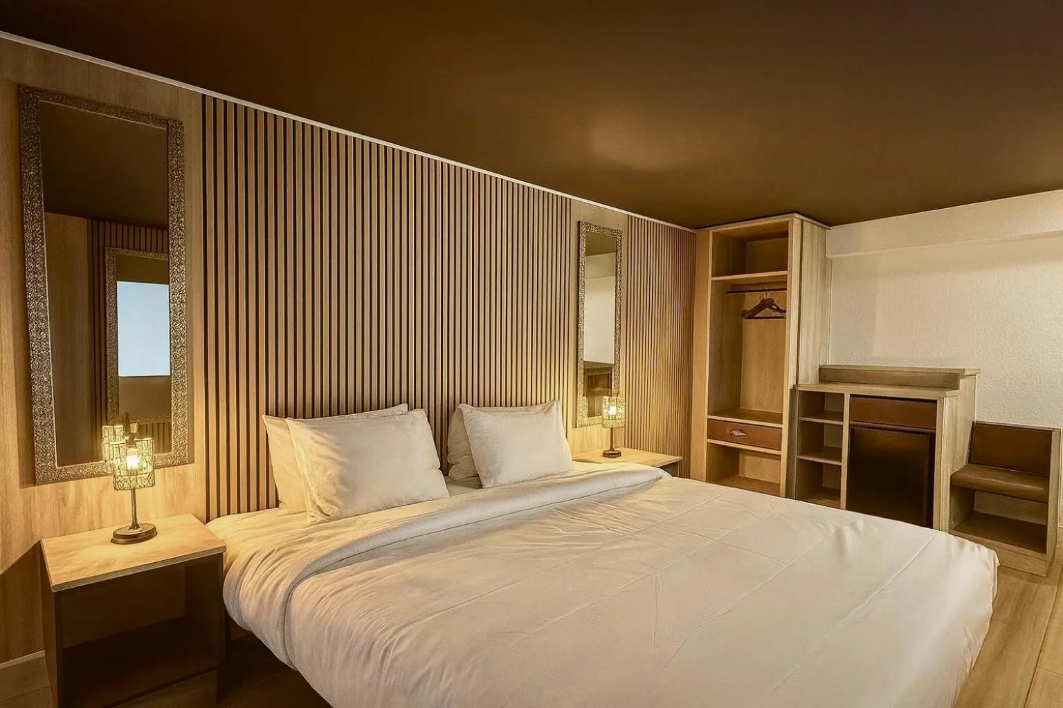 Bed in Tropical Palms Hotel