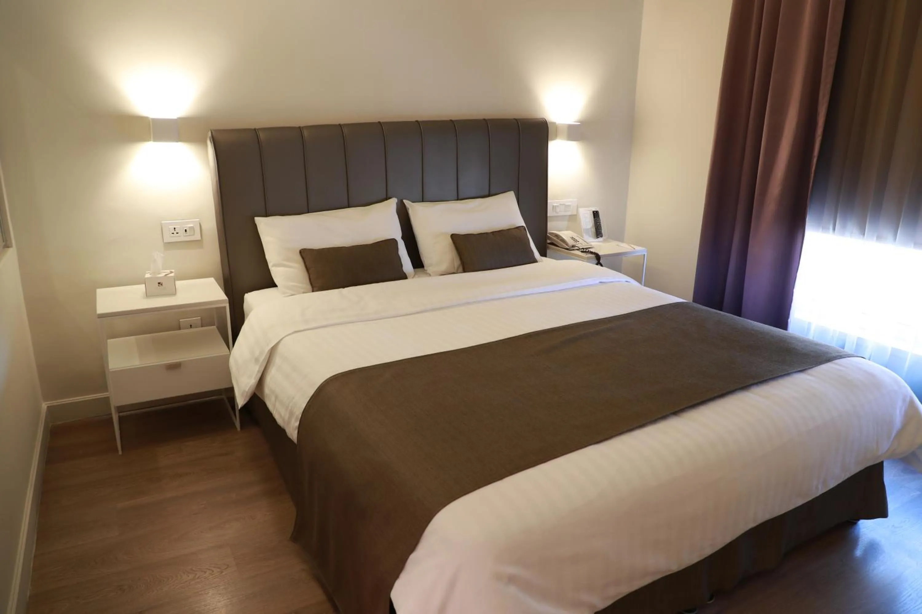 Bed in AlQasr Metropole Hotel