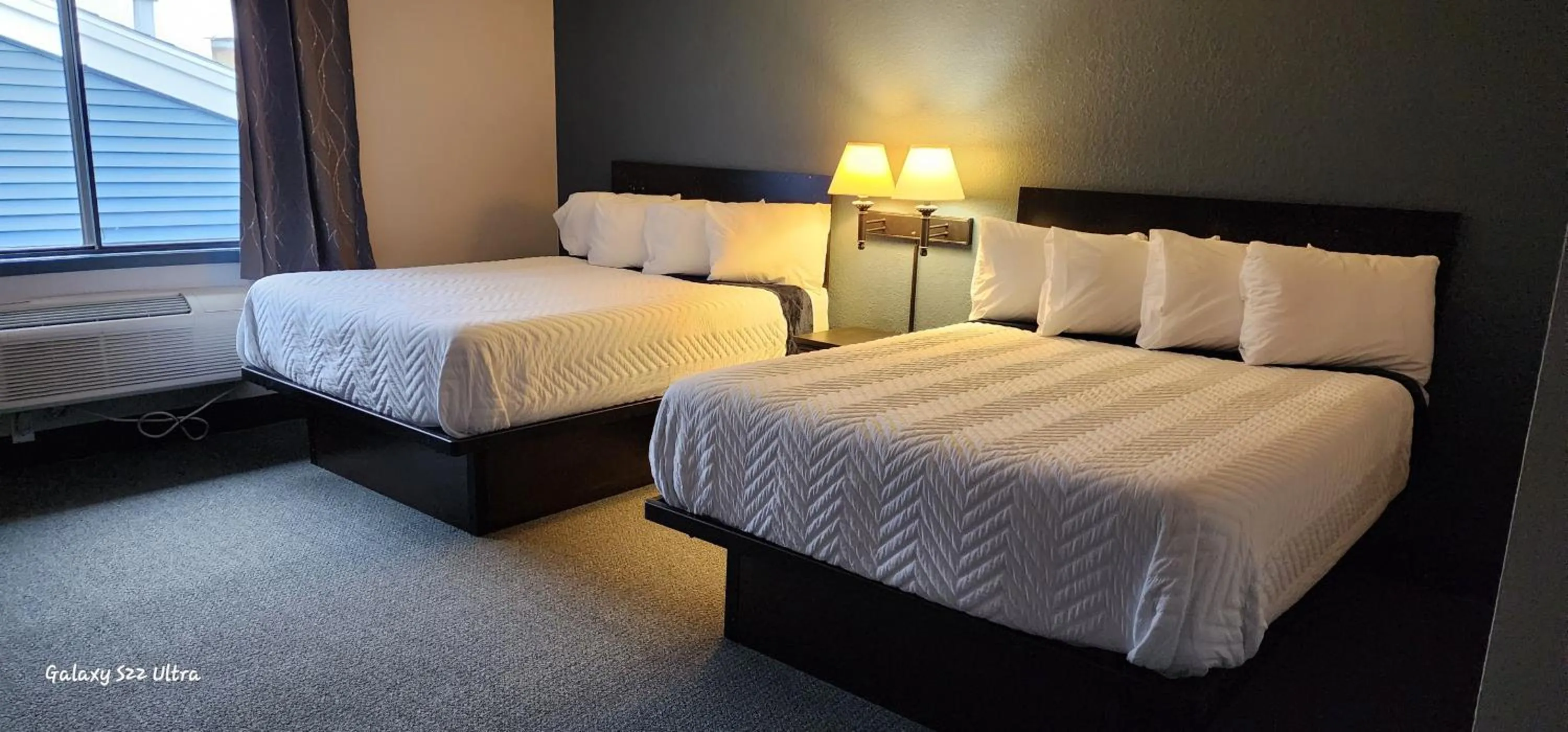 Bed in The Oasis Hotel & Bar