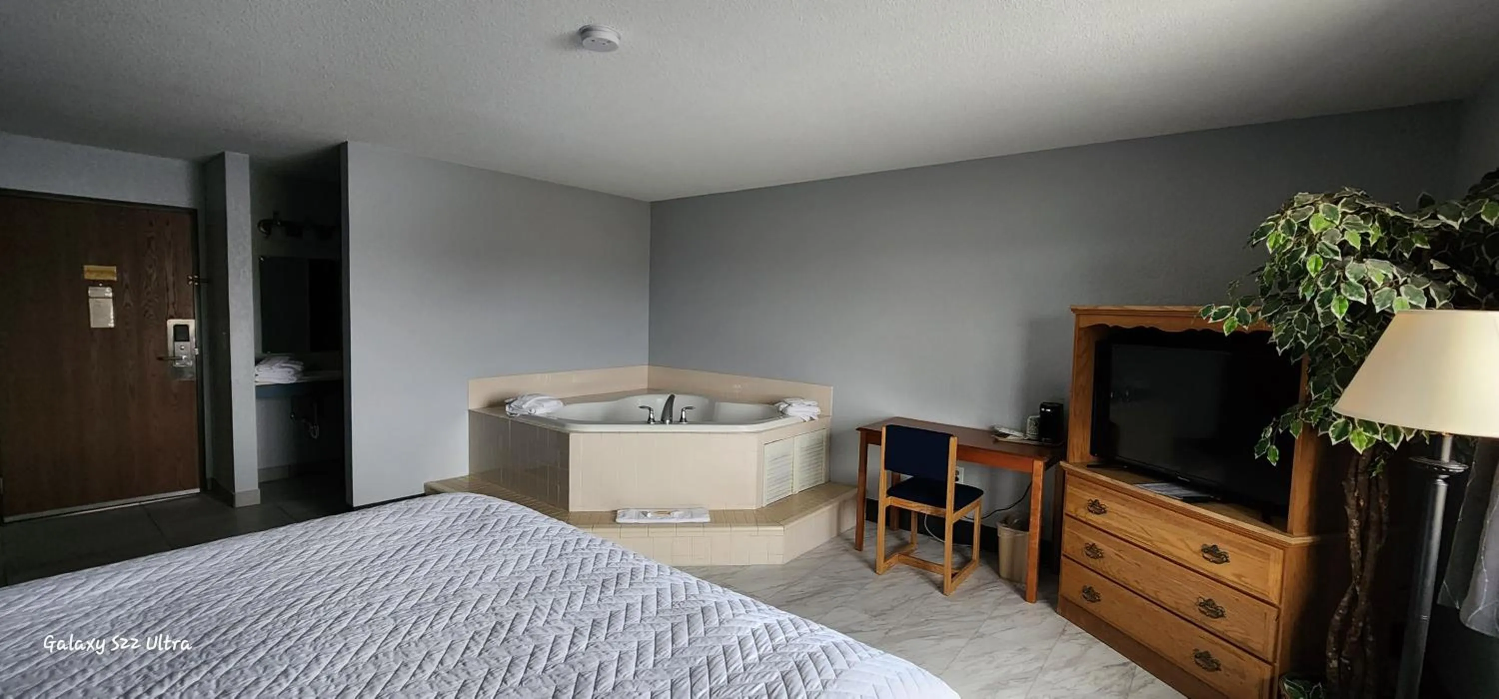 Bed in The Oasis Hotel & Bar