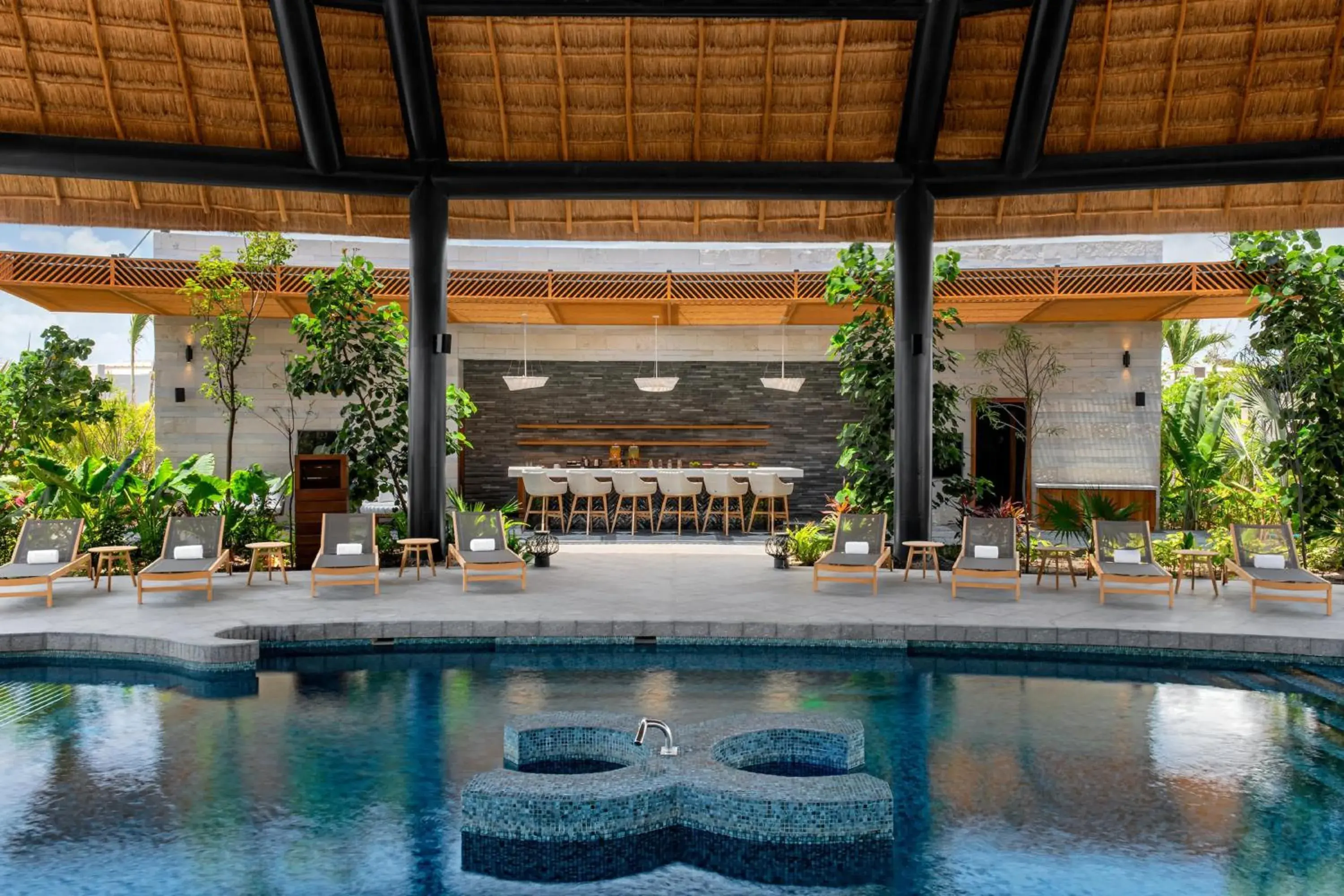 Pool view in Conrad Tulum Riviera Maya Pool view in Conrad Tulum Riviera Maya