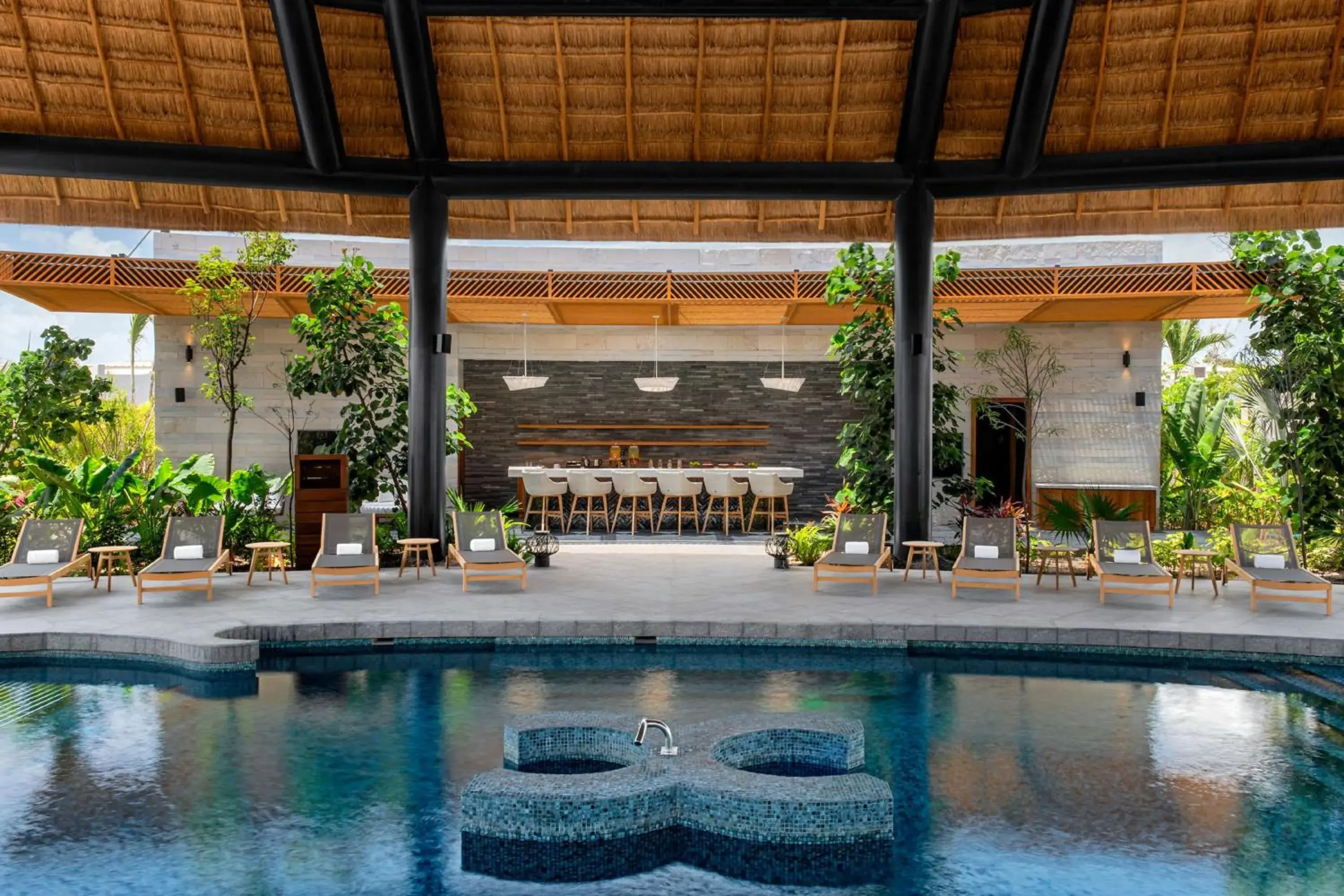 Pool view in Conrad Tulum Riviera Maya Pool view in Conrad Tulum Riviera Maya