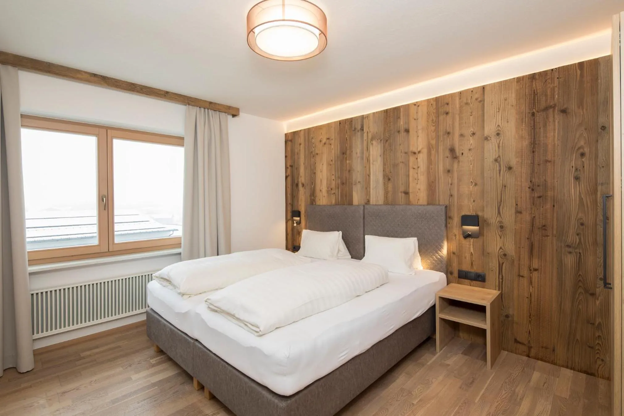 Bed in Angerer Alpine Suiten und Familienappartements Tirol