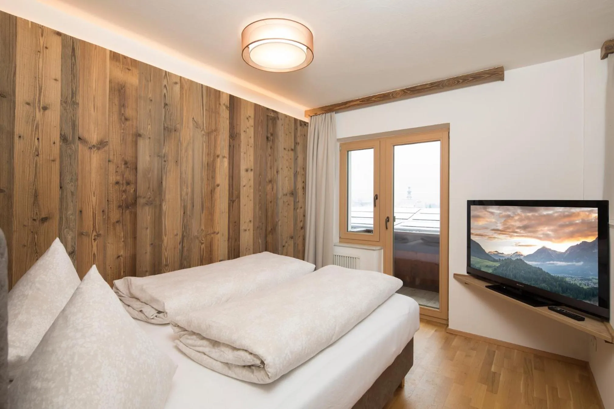 Bed in Angerer Alpine Suiten und Familienappartements Tirol