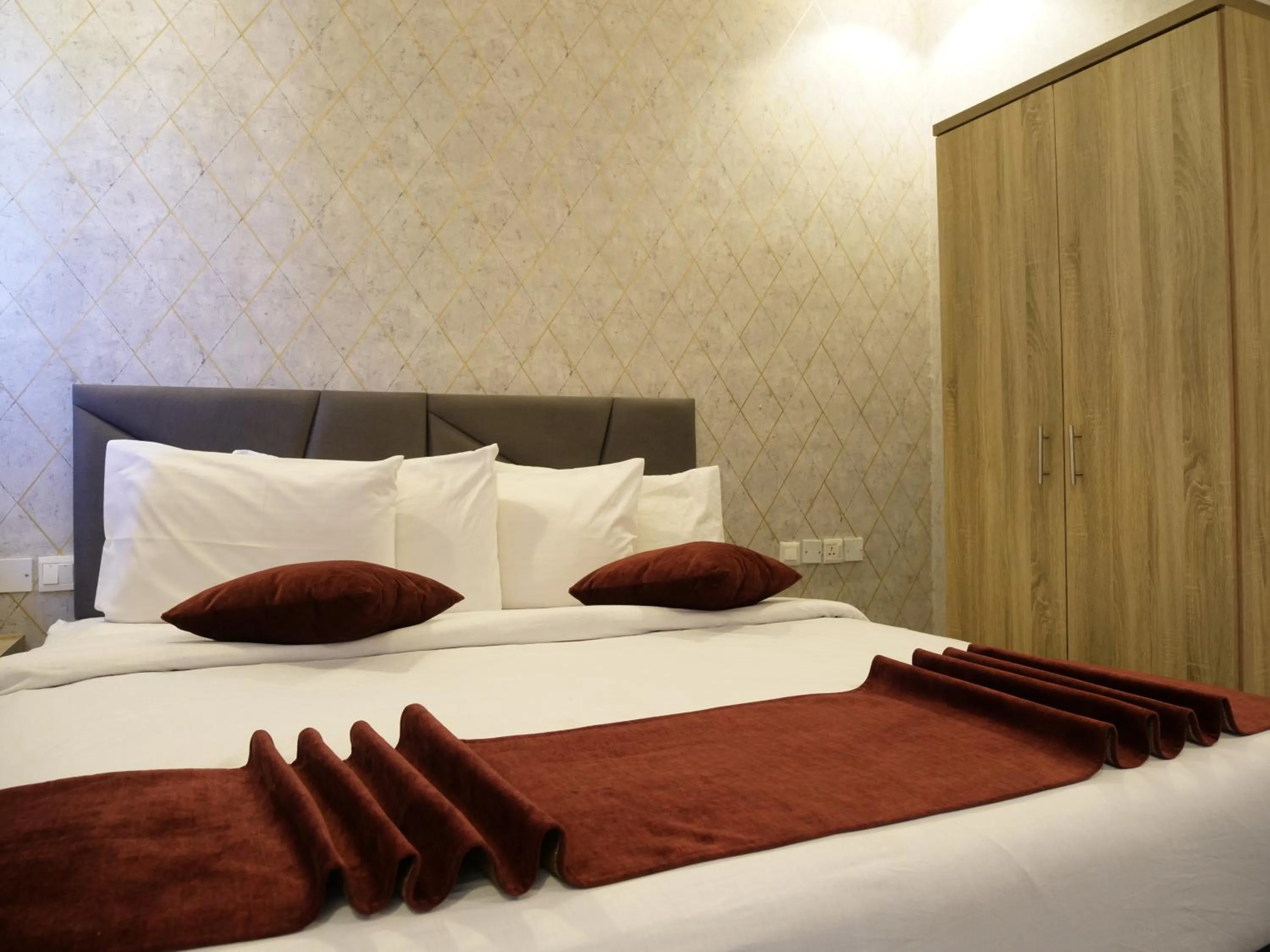 Bed in Twins Downtown Hotel