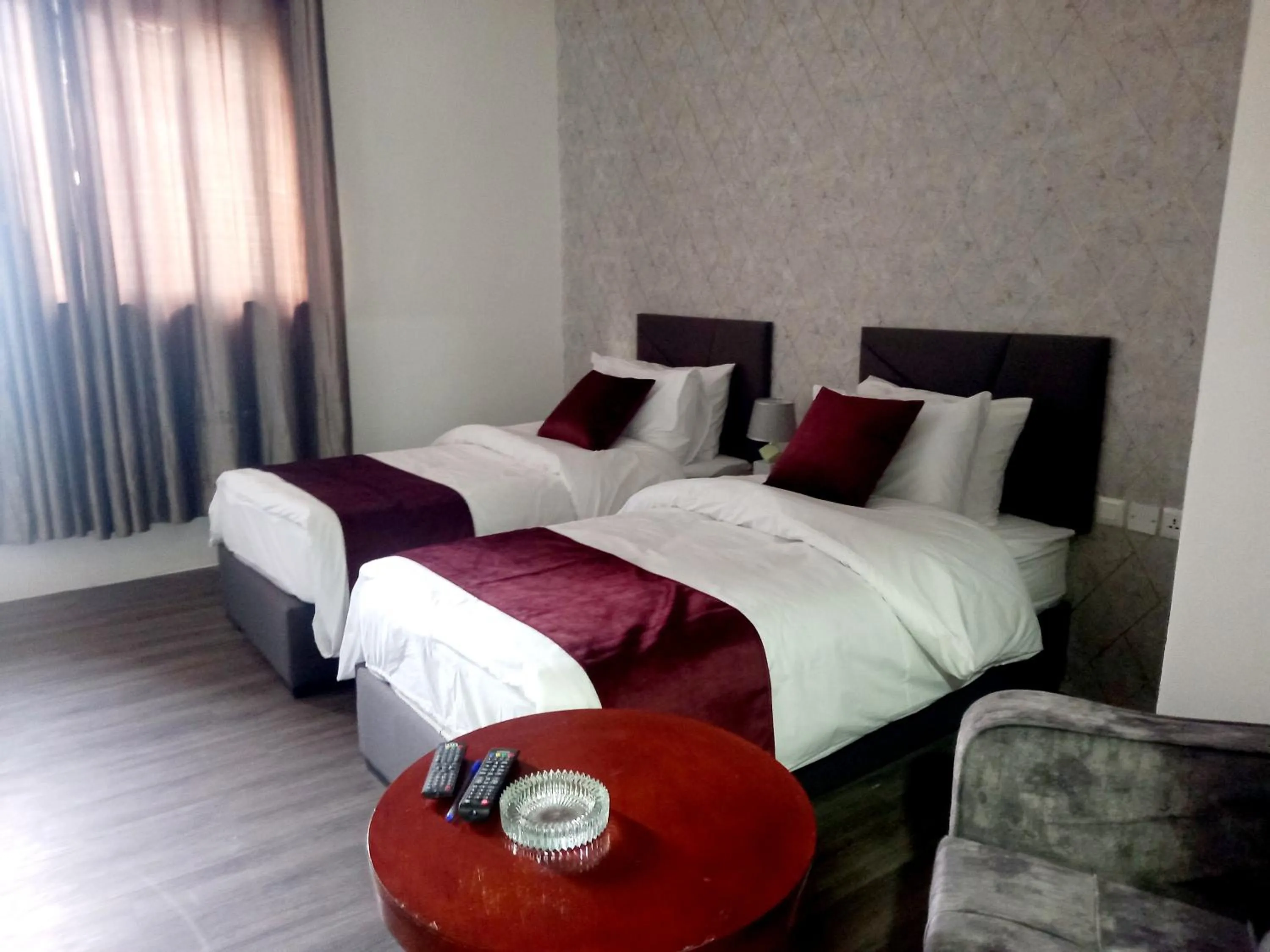 Bed in Twins Downtown Hotel