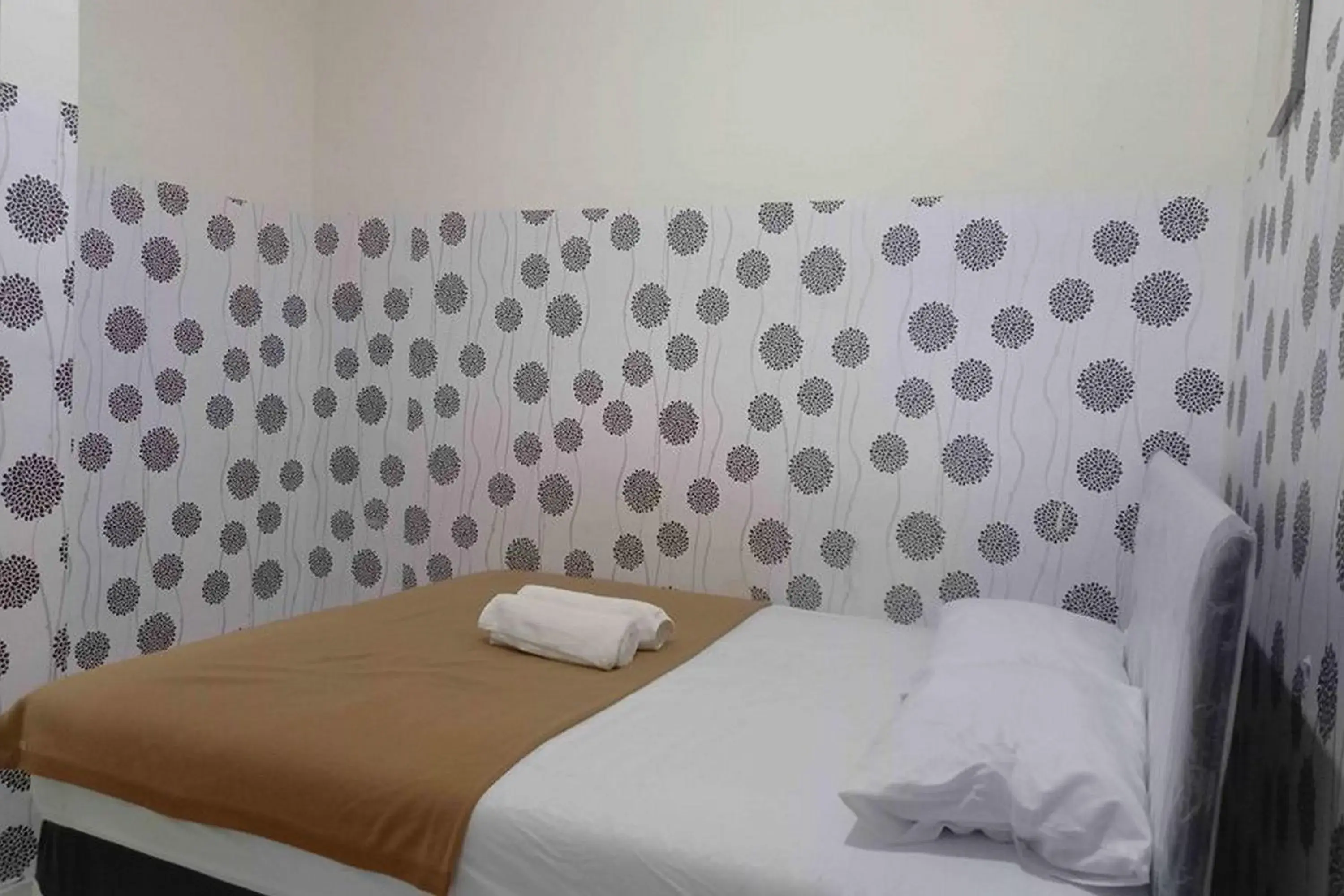 Bed in Omah Jaban Jogja Mitra RedDoorz Bed in Omah Jaban Jogja Mitra RedDoorz