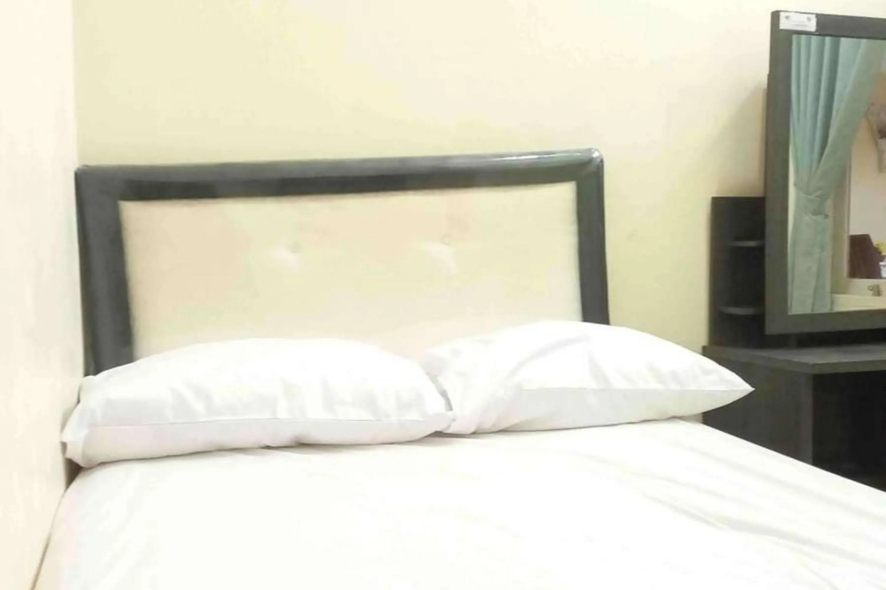 Bed in Omah Jaban Jogja Mitra RedDoorz Bed in Omah Jaban Jogja Mitra RedDoorz