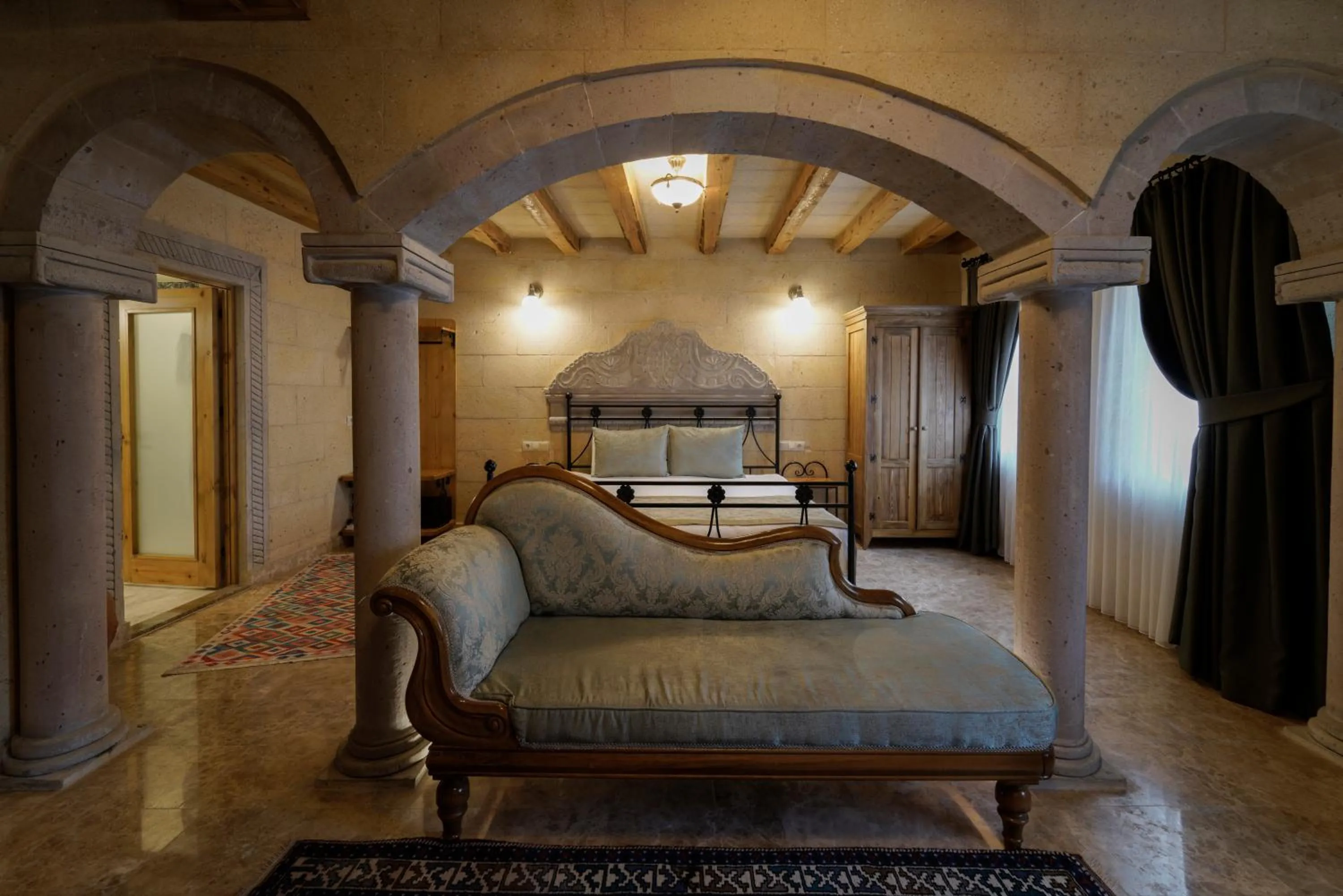 Seating area, Bed in Cratus Stone Palace