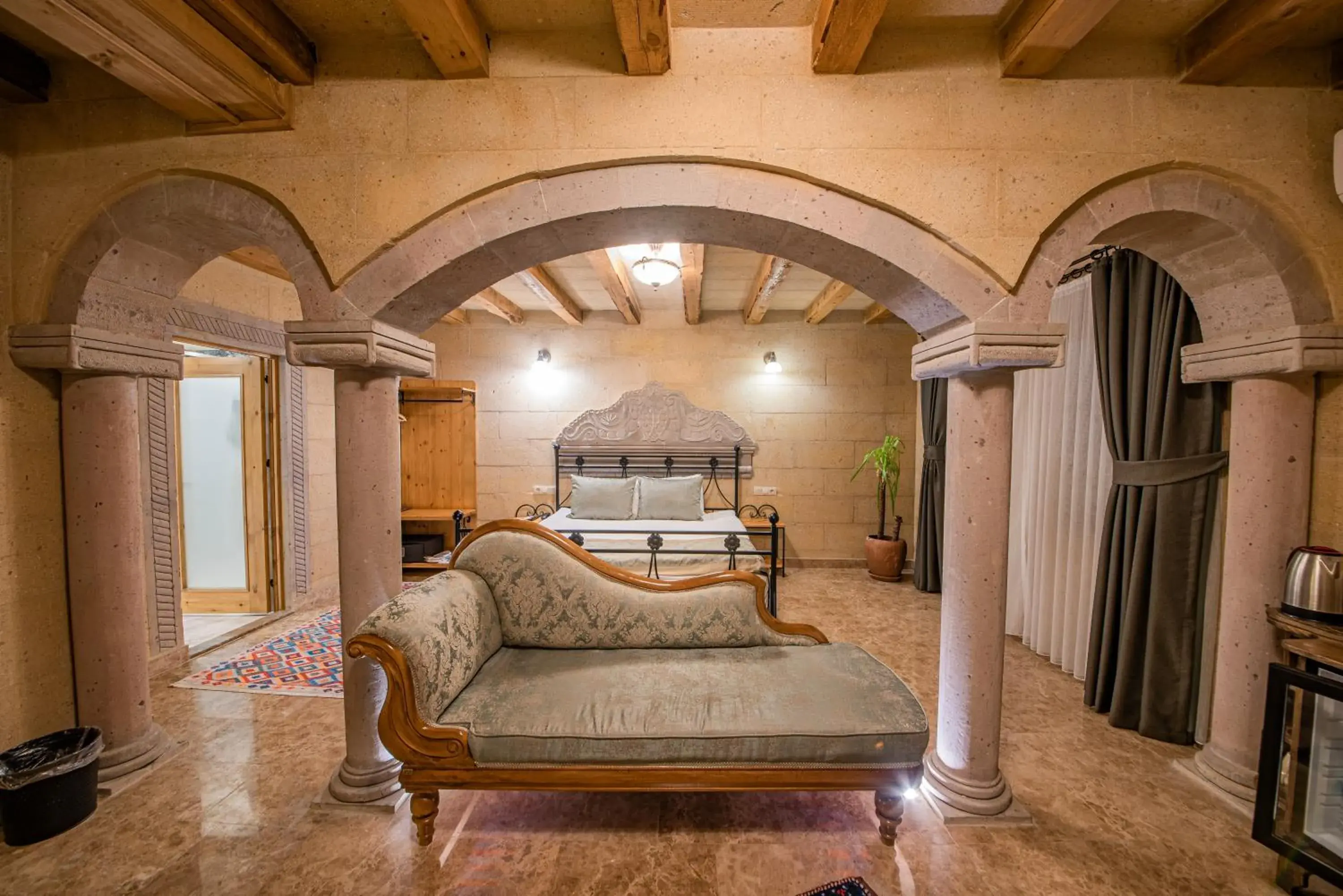 Seating area, Bed in Cratus Stone Palace Seating area, Bed in Cratus Stone Palace