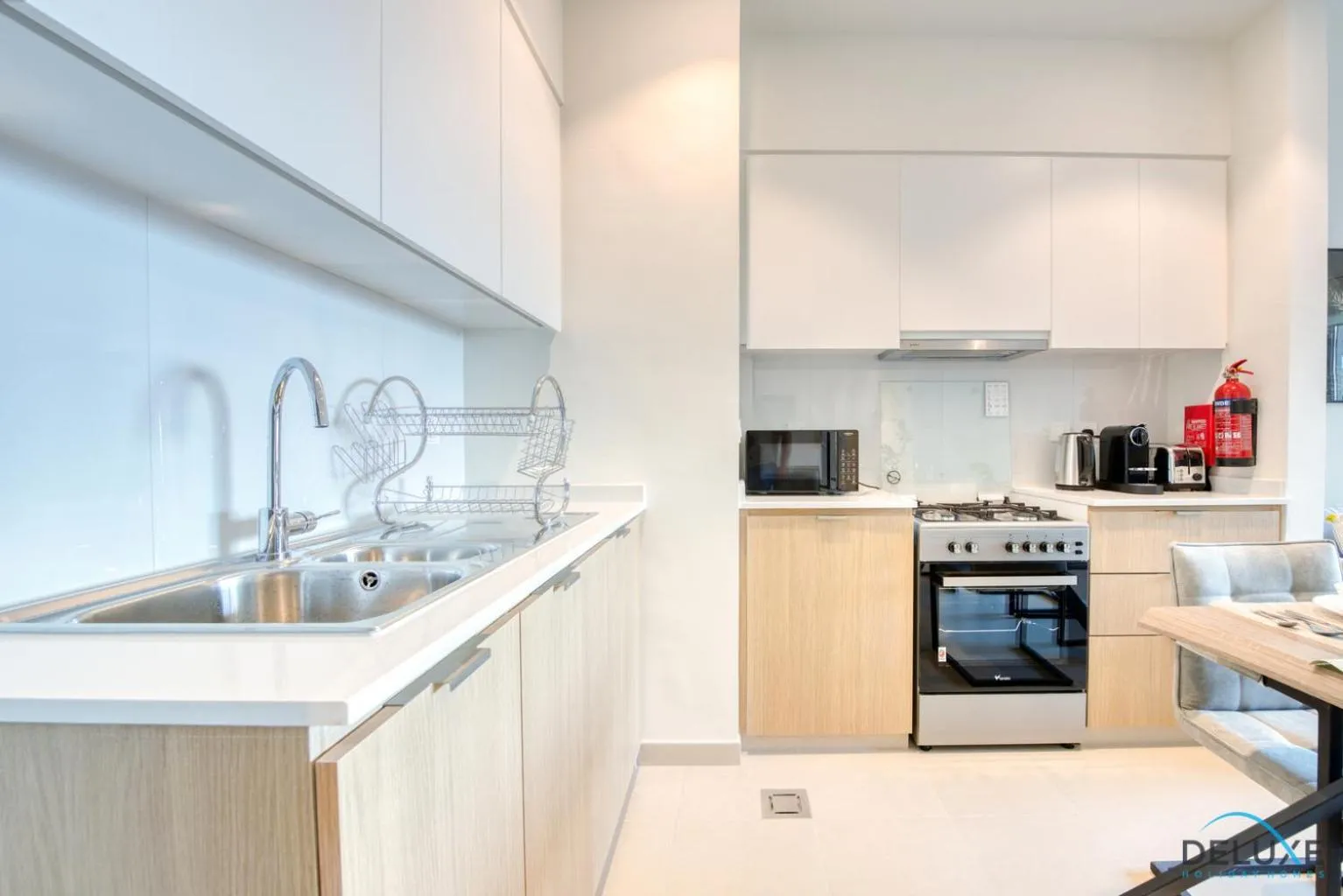 Kitchen or kitchenette in Community Living 2BR Close to Emirates Golf Club, Golf Views A, Madinat Al Mataar by Deluxe Holiday Homes