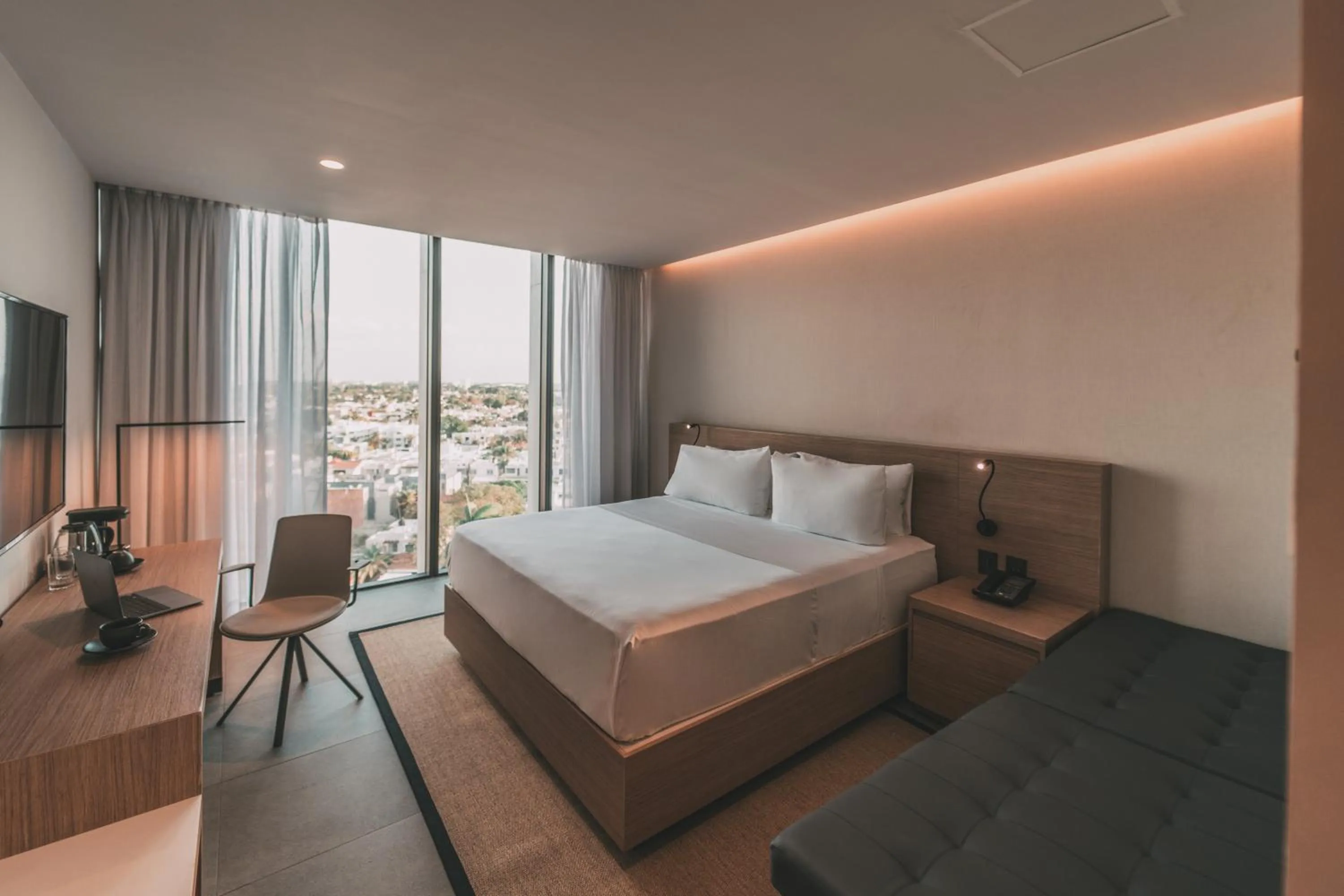 Communal lounge/ TV room, Bed in AKEN MIND Mérida Hotel