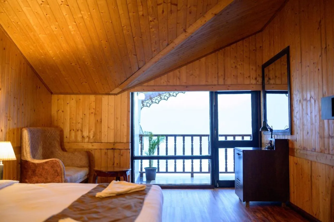 Seating area, Bed in Istana Resort & Spa