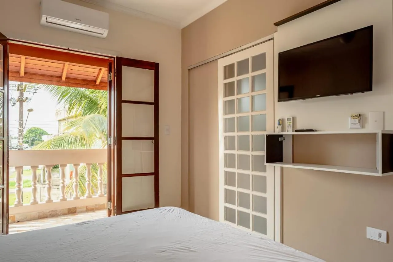 Balcony/Terrace, Bed in Pousada Oásis