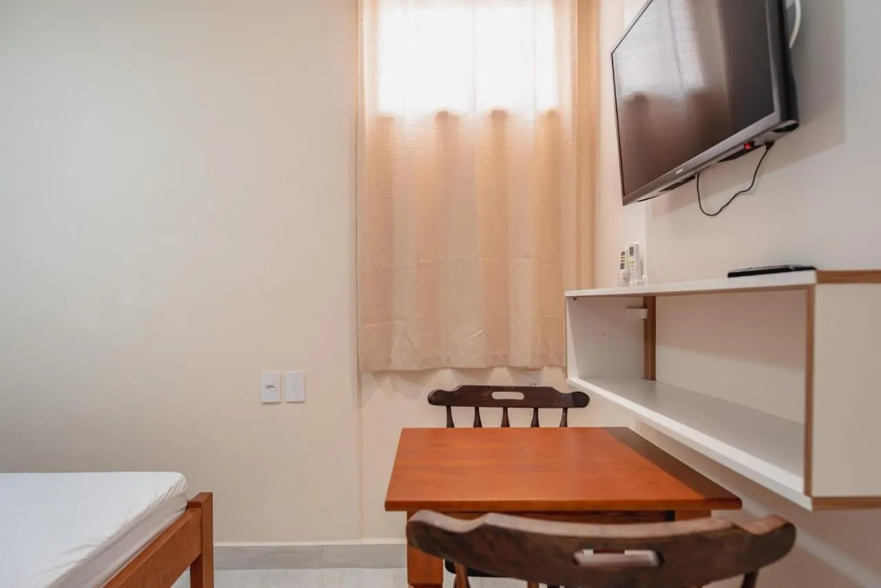 Communal lounge/ TV room, Bed in Pousada Oásis