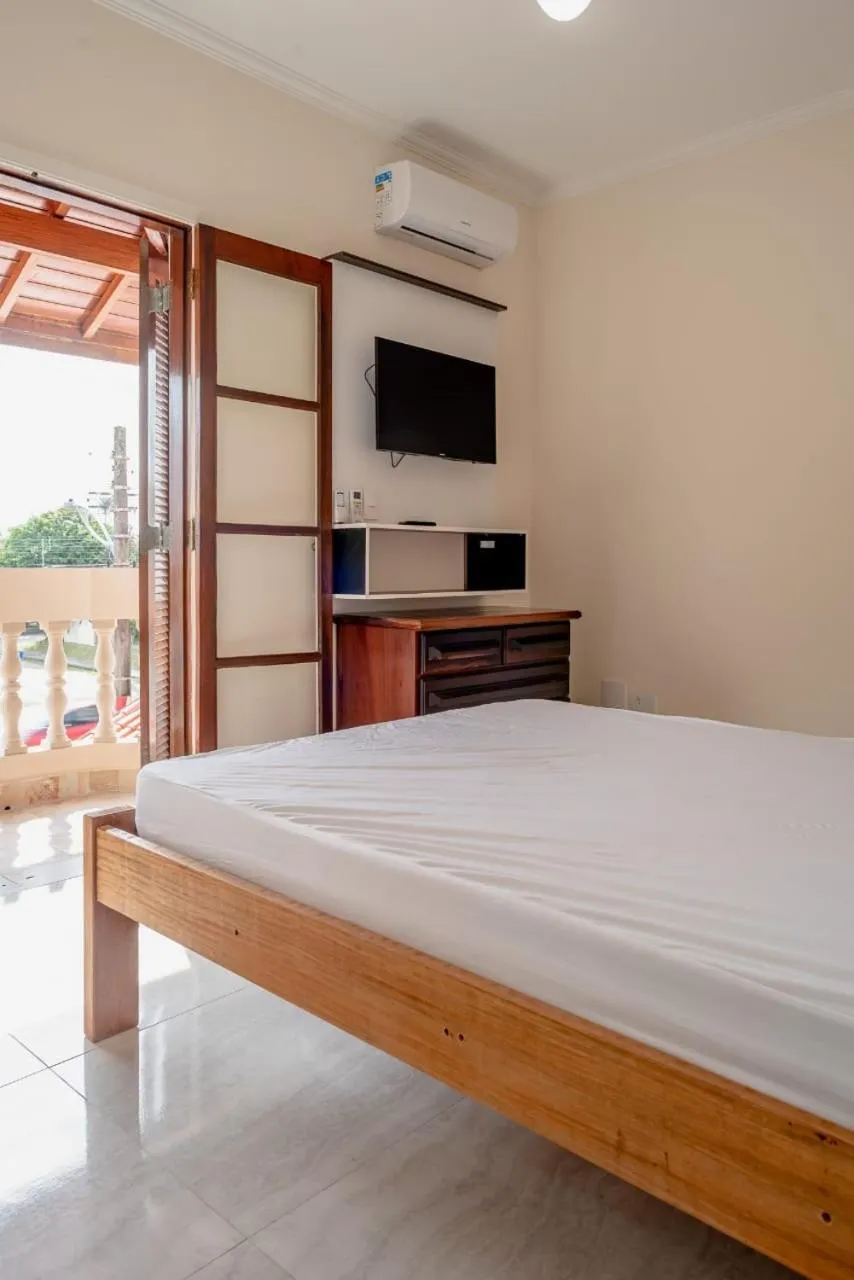 Bed in Pousada Oásis