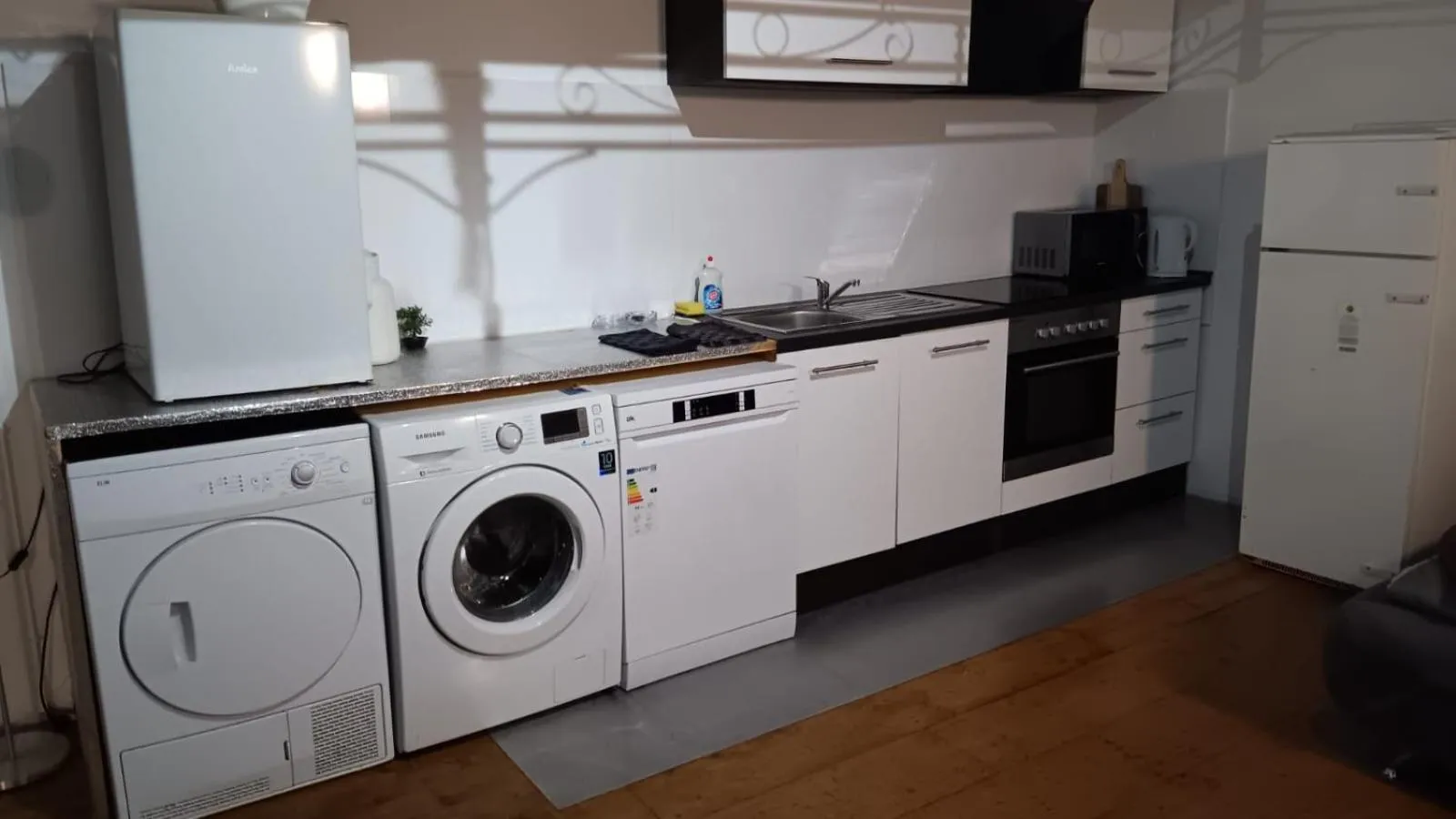 washing machine in Geinberg Suites & Via Nova Lodges