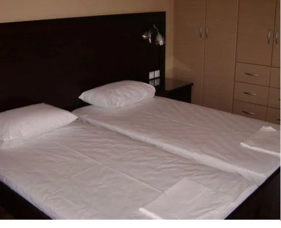 Bed in Pantheon Hotel & Suites