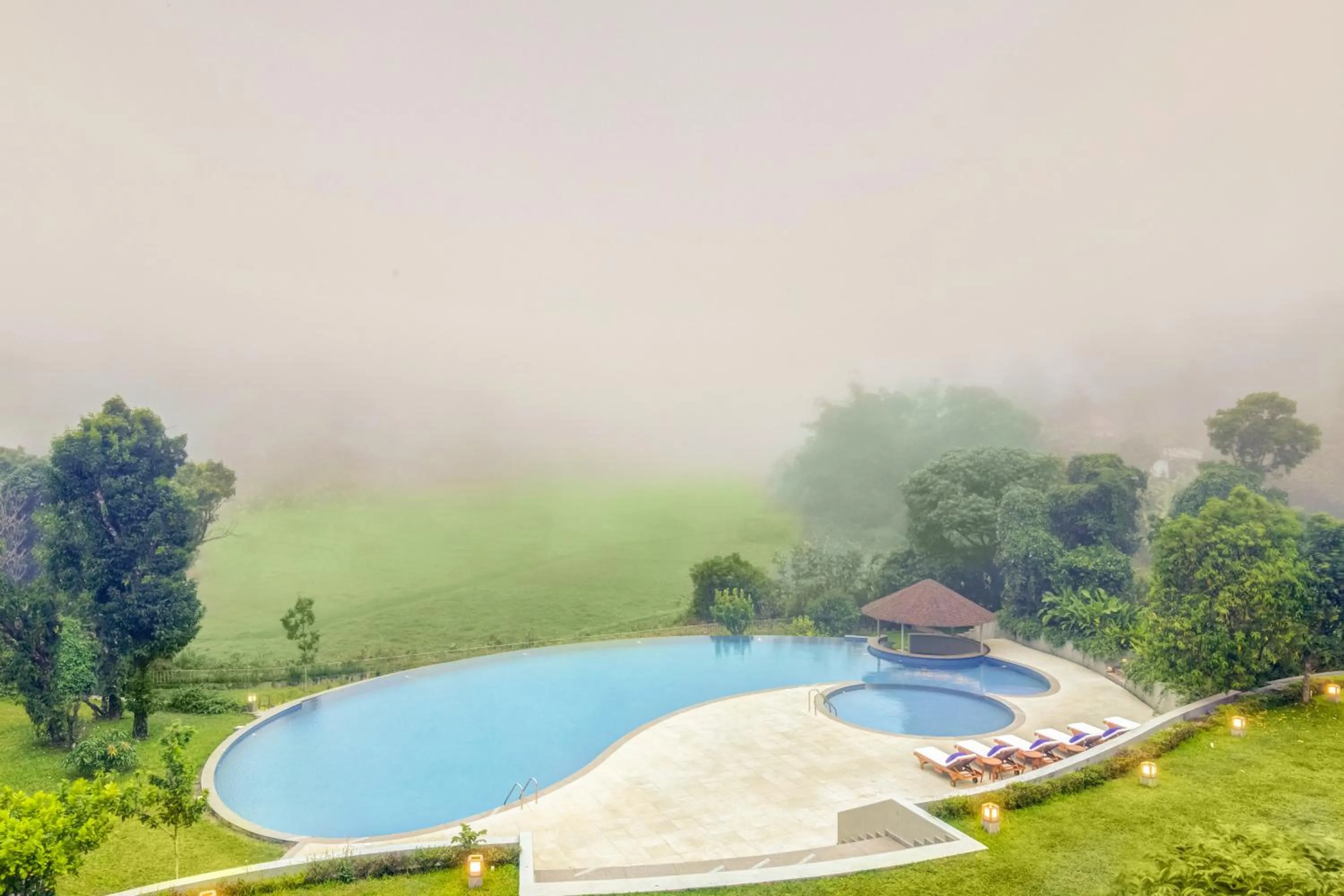 Swimming pool in Aurika, Coorg Luxury by Lemon Tree Hotels