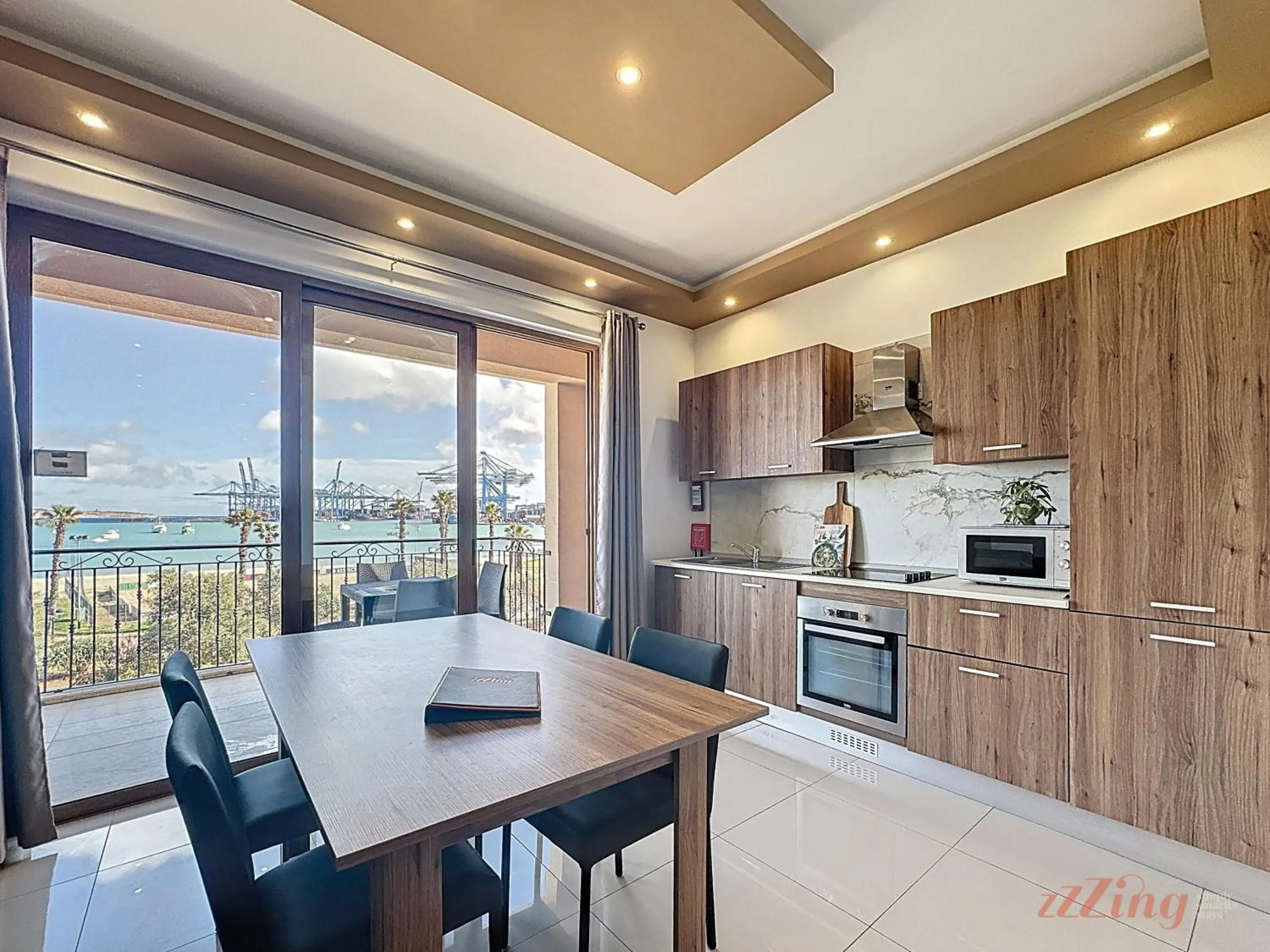 Dining area in Elegant Seafront Duplex with Stunning Panoramic Views
