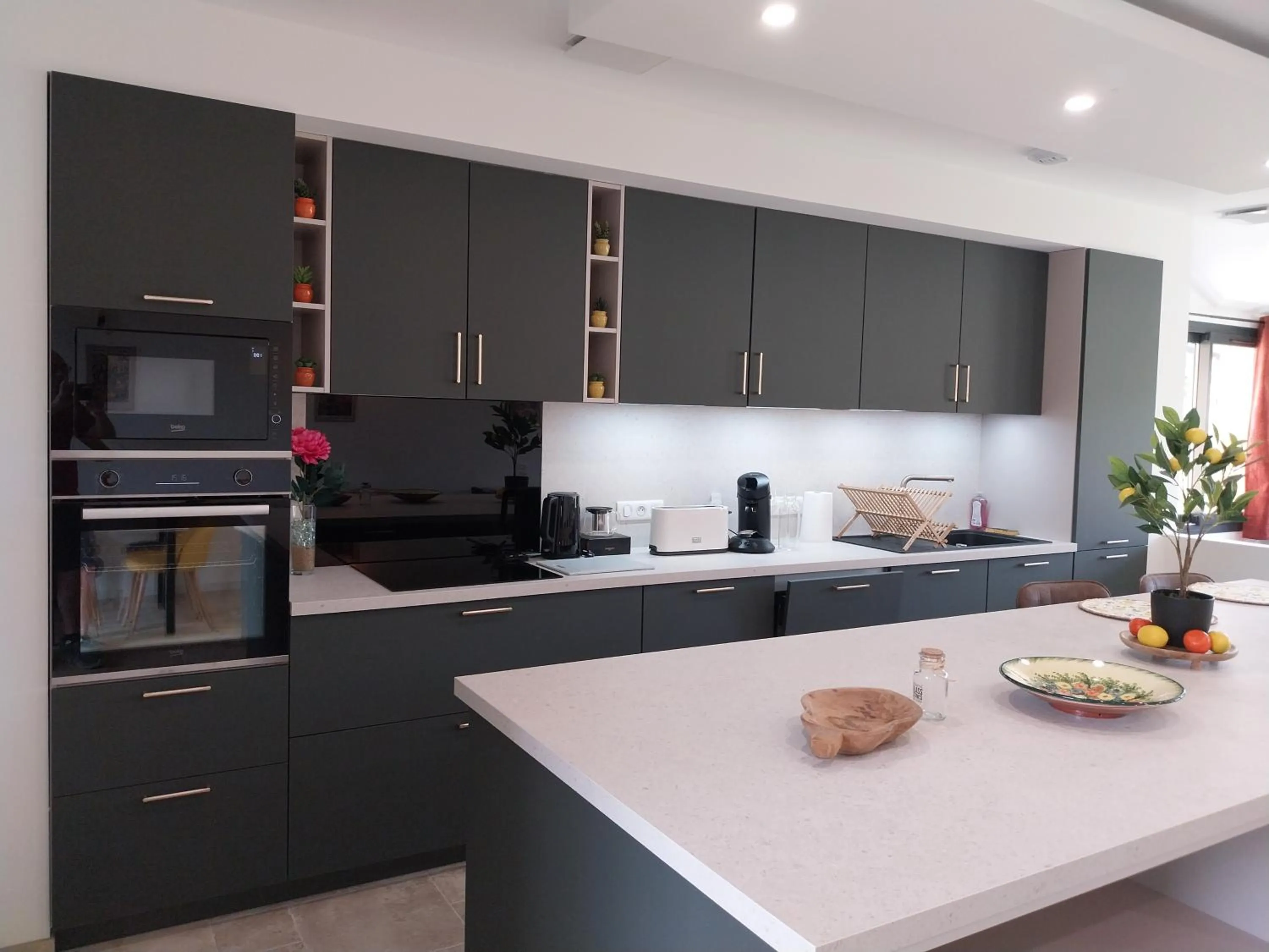 Communal kitchen in Logis Hôtel Restaurant Cruzel