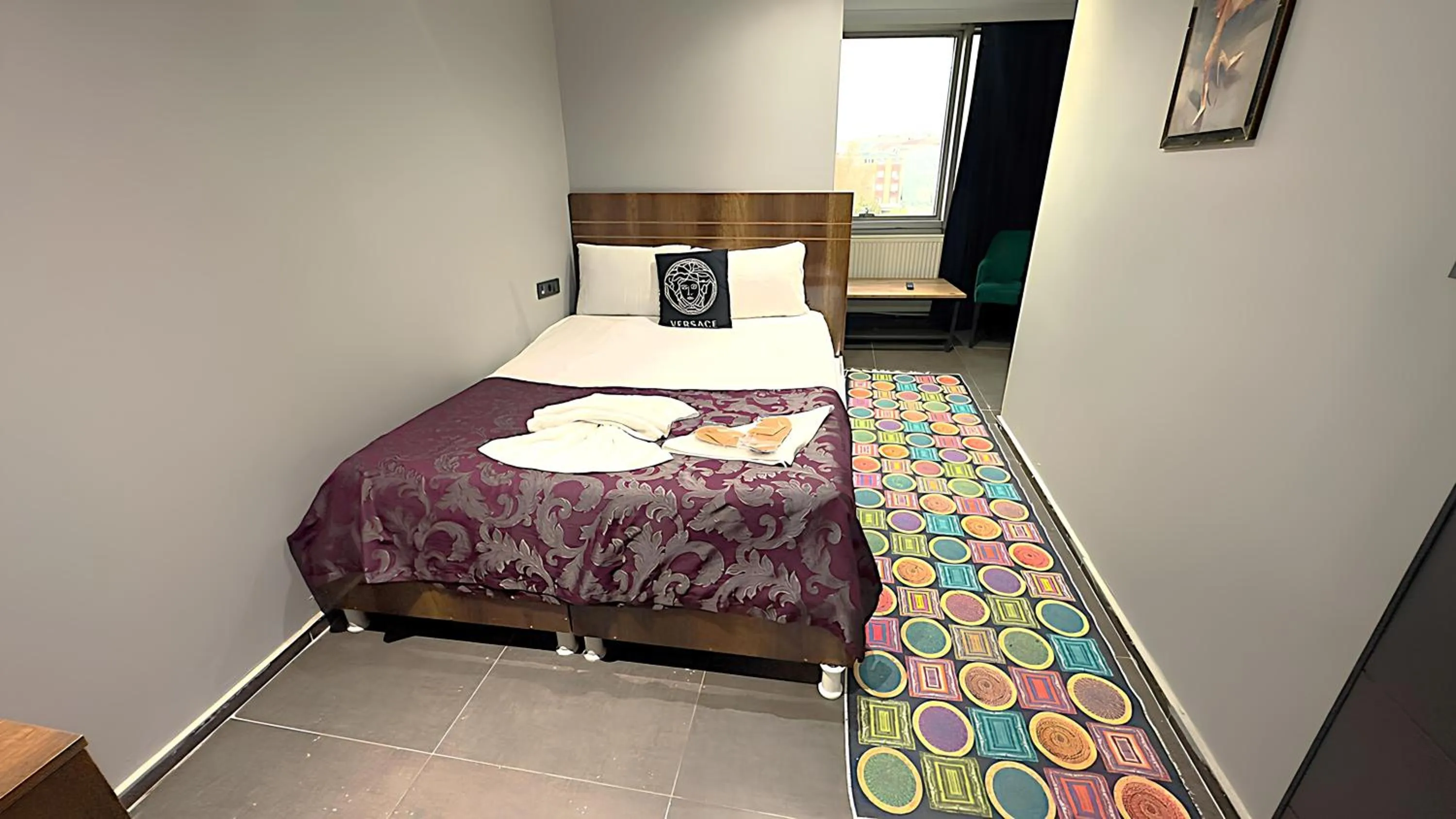 Bed in Grand Lara Hotel & Apartments