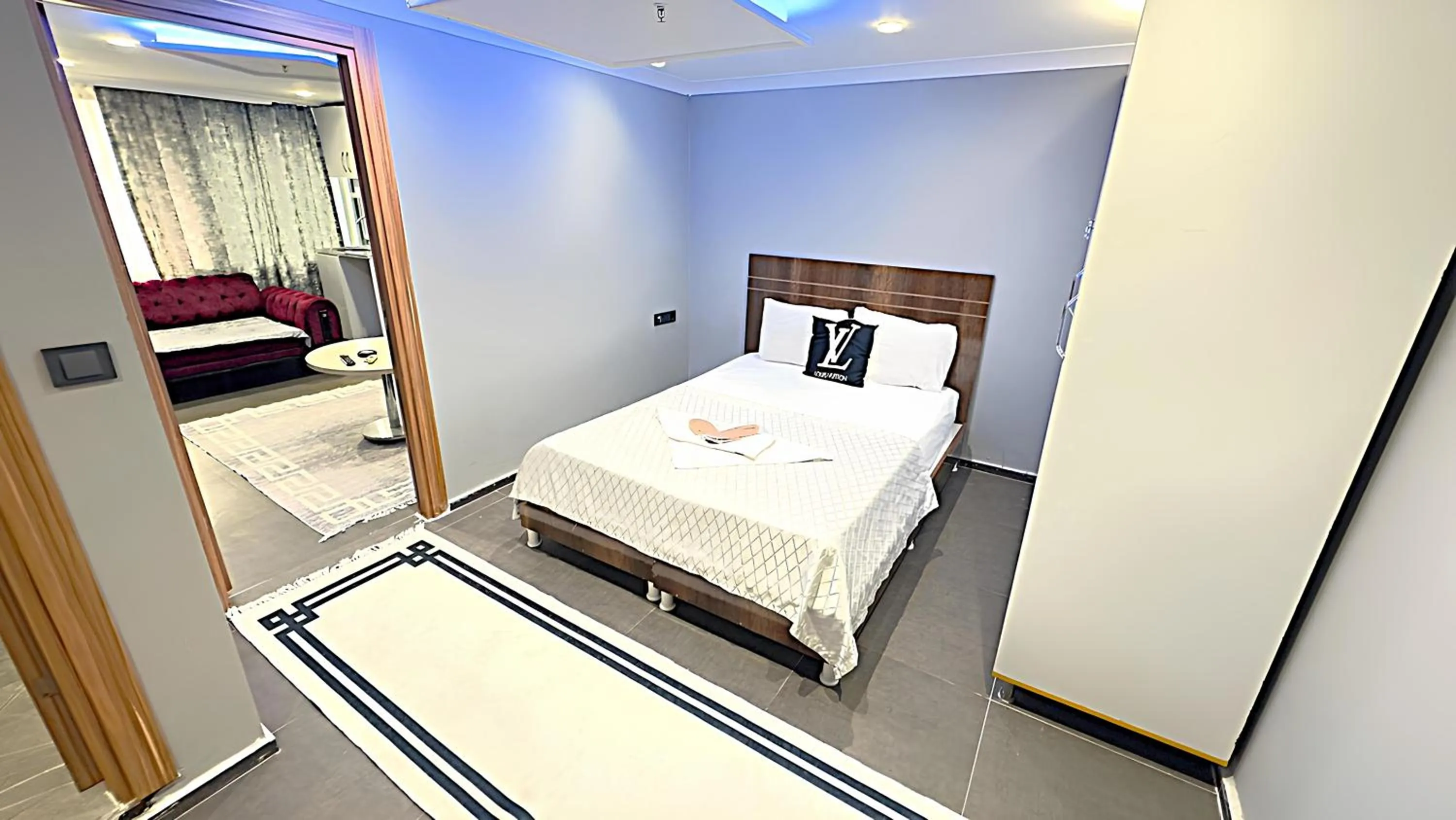 Bed in Grand Lara Hotel & Apartments