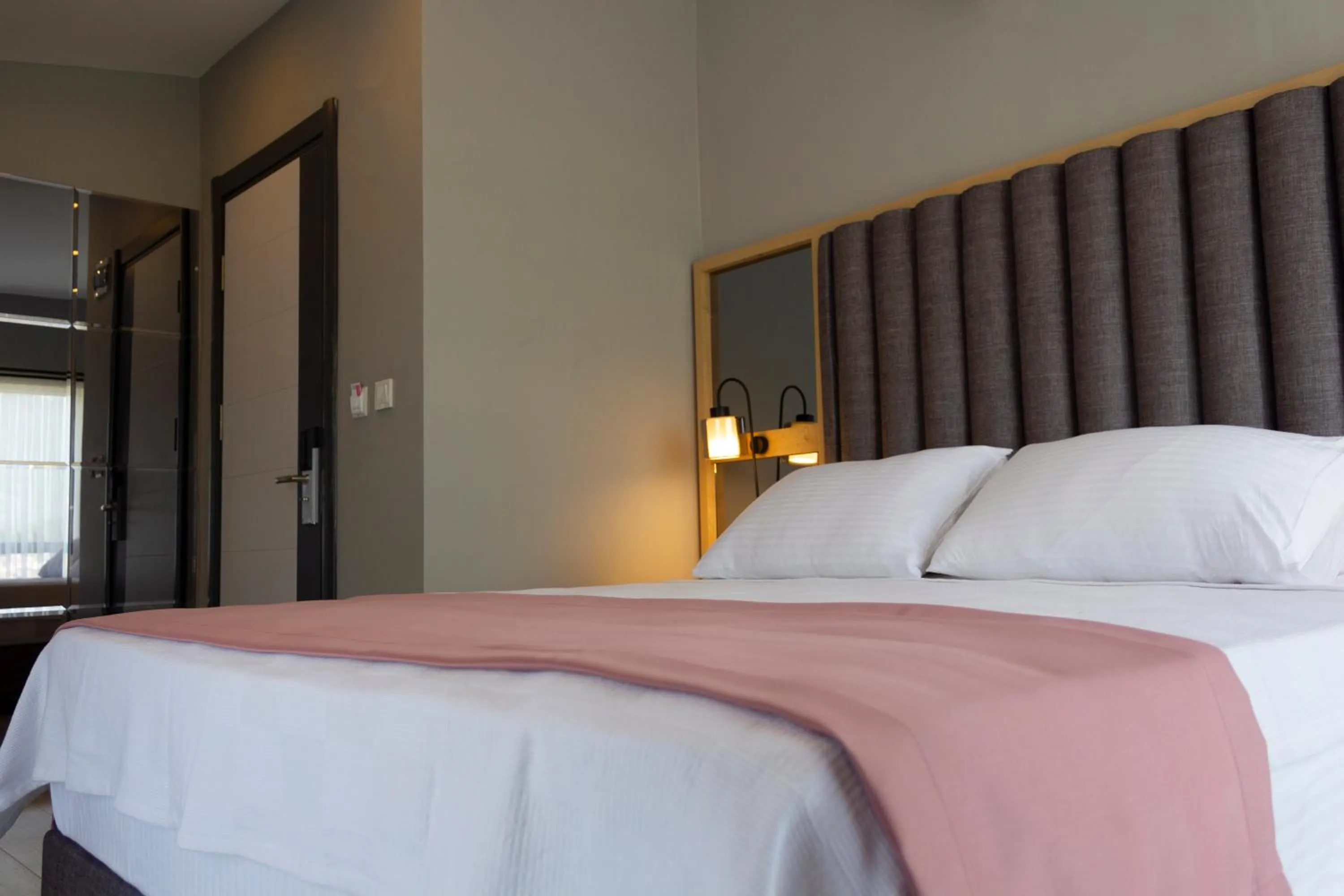 Bed in L'opera Deluxe Hotel