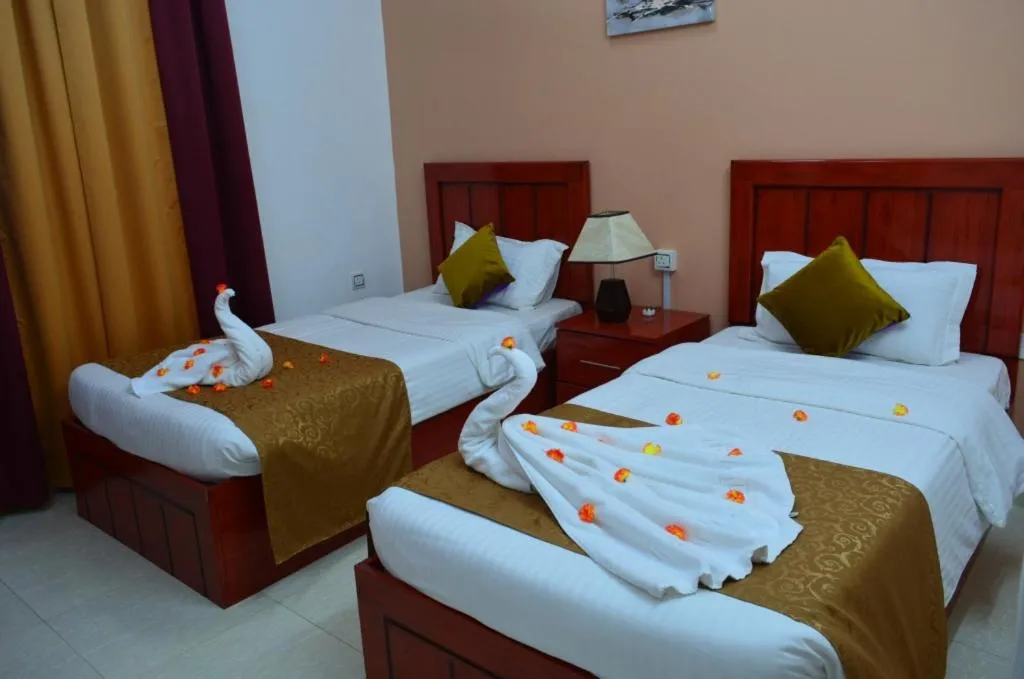 Bed in Al Karam Hotel Apartment