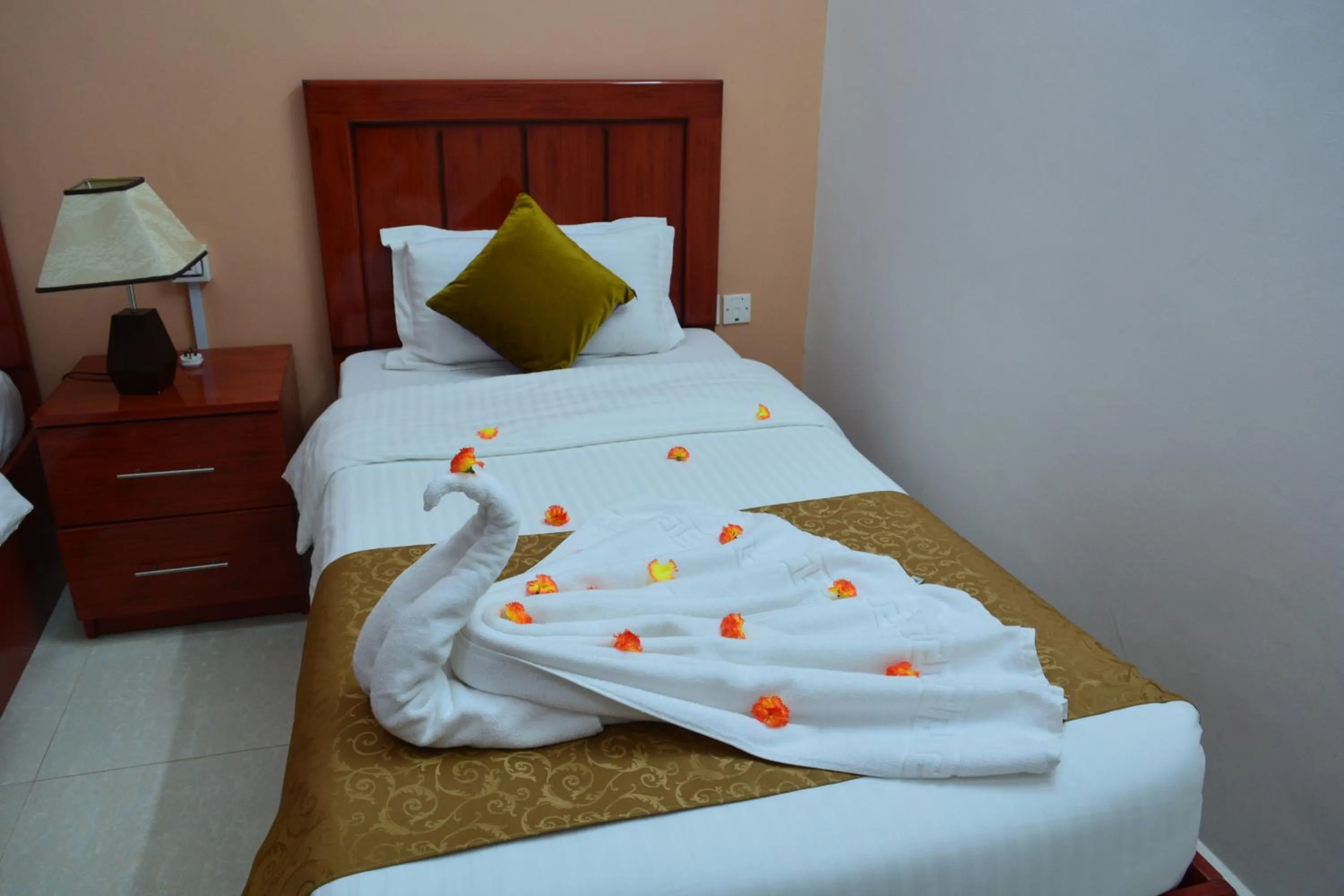 Bed in Al Karam Hotel Apartment
