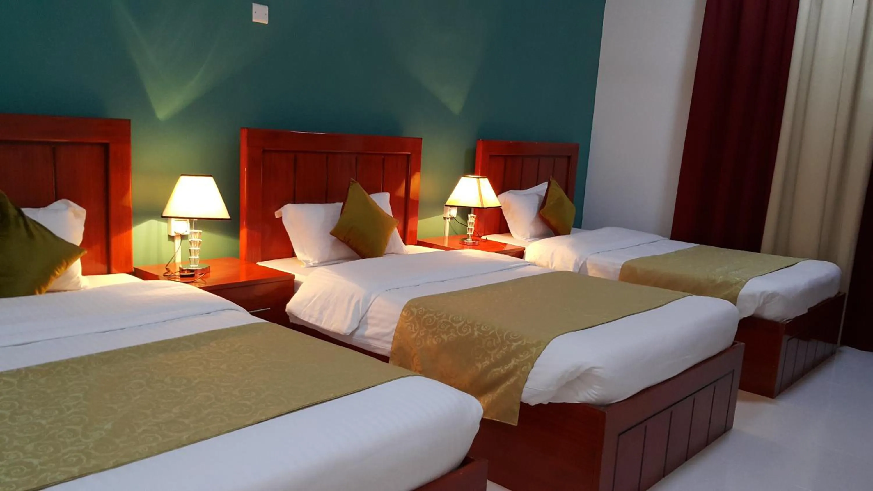 Bed in Al Karam Hotel Apartment