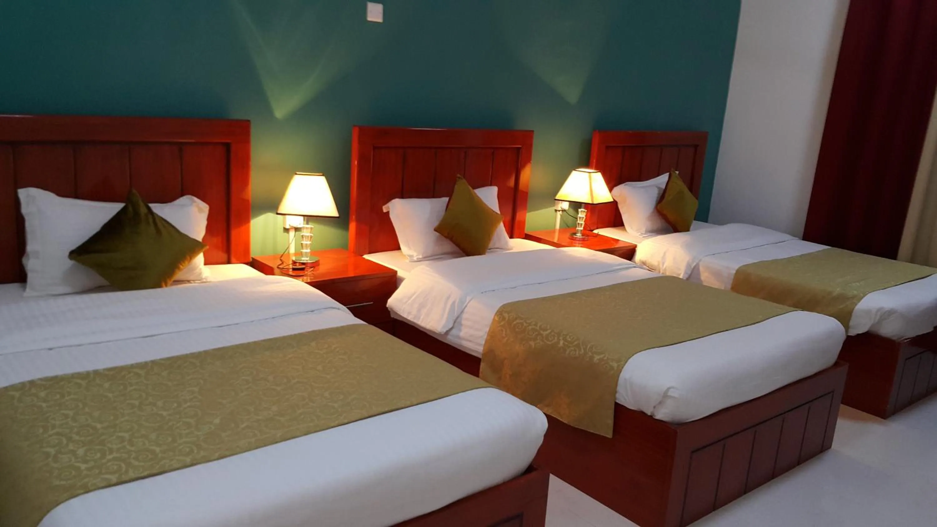 Bed in Al Karam Hotel Apartment