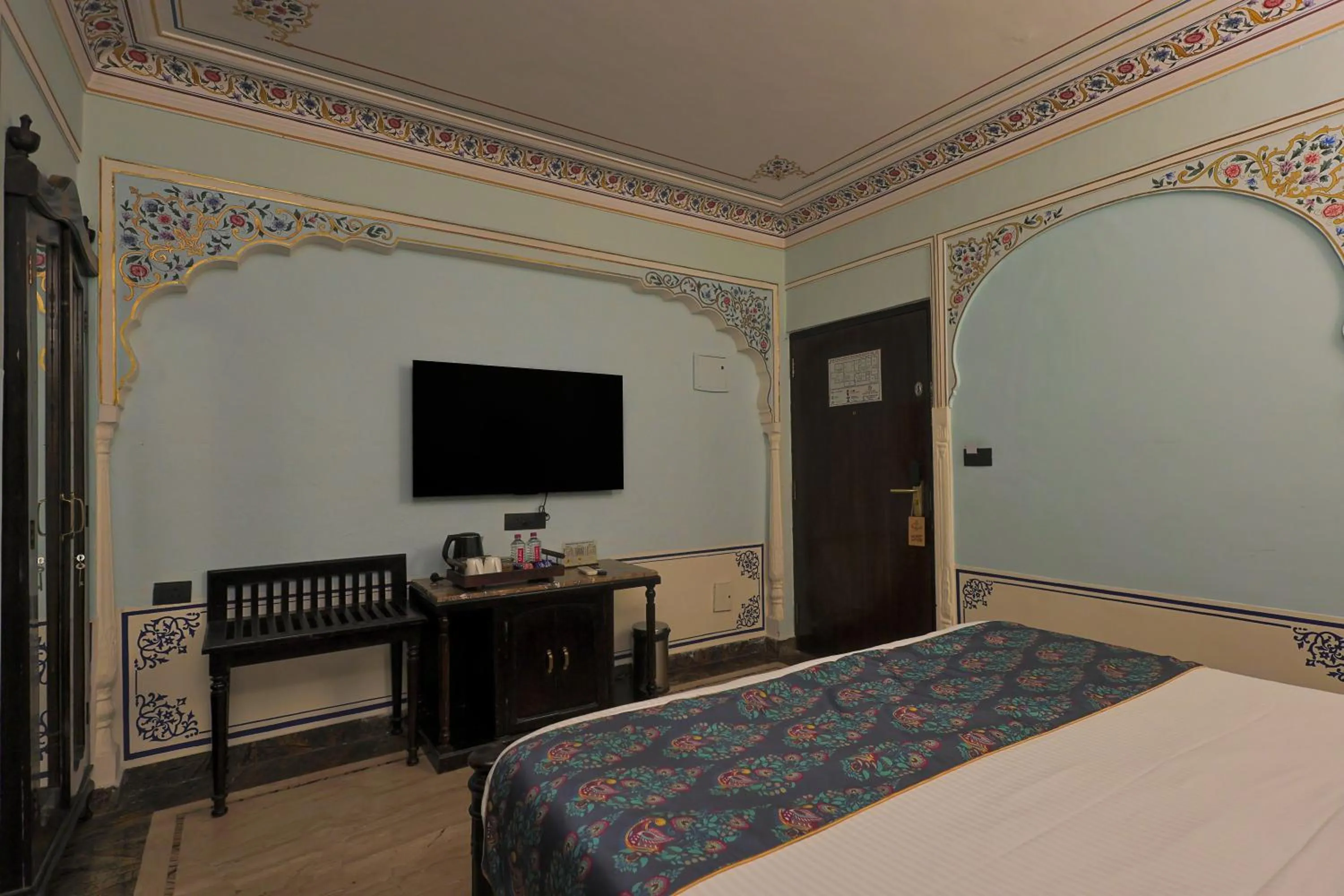 Communal lounge/ TV room, Bed in WelcomHeritage Traditional Haveli