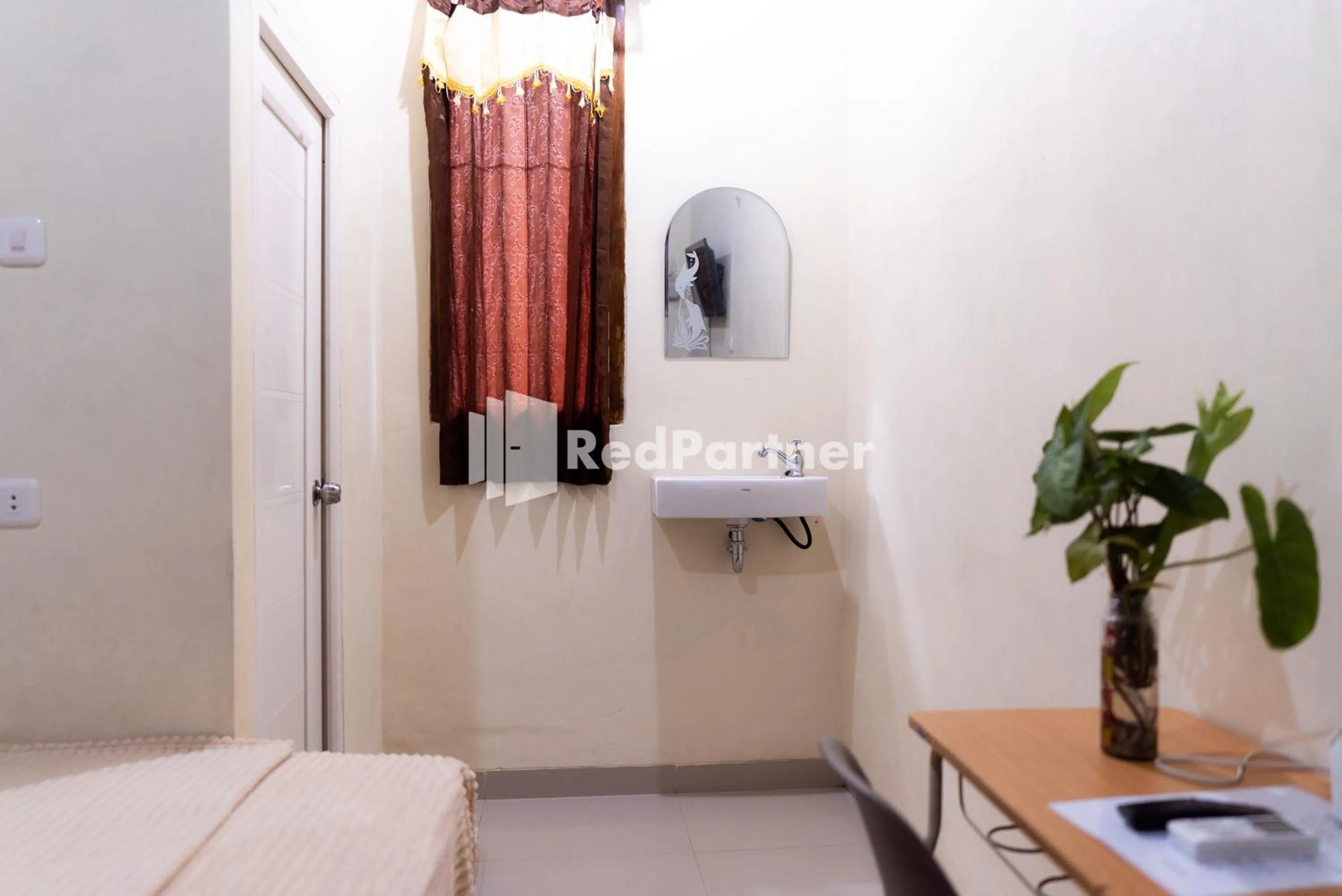 Bedroom, TV/Entertainment Center in ITR Homestay RedPartner