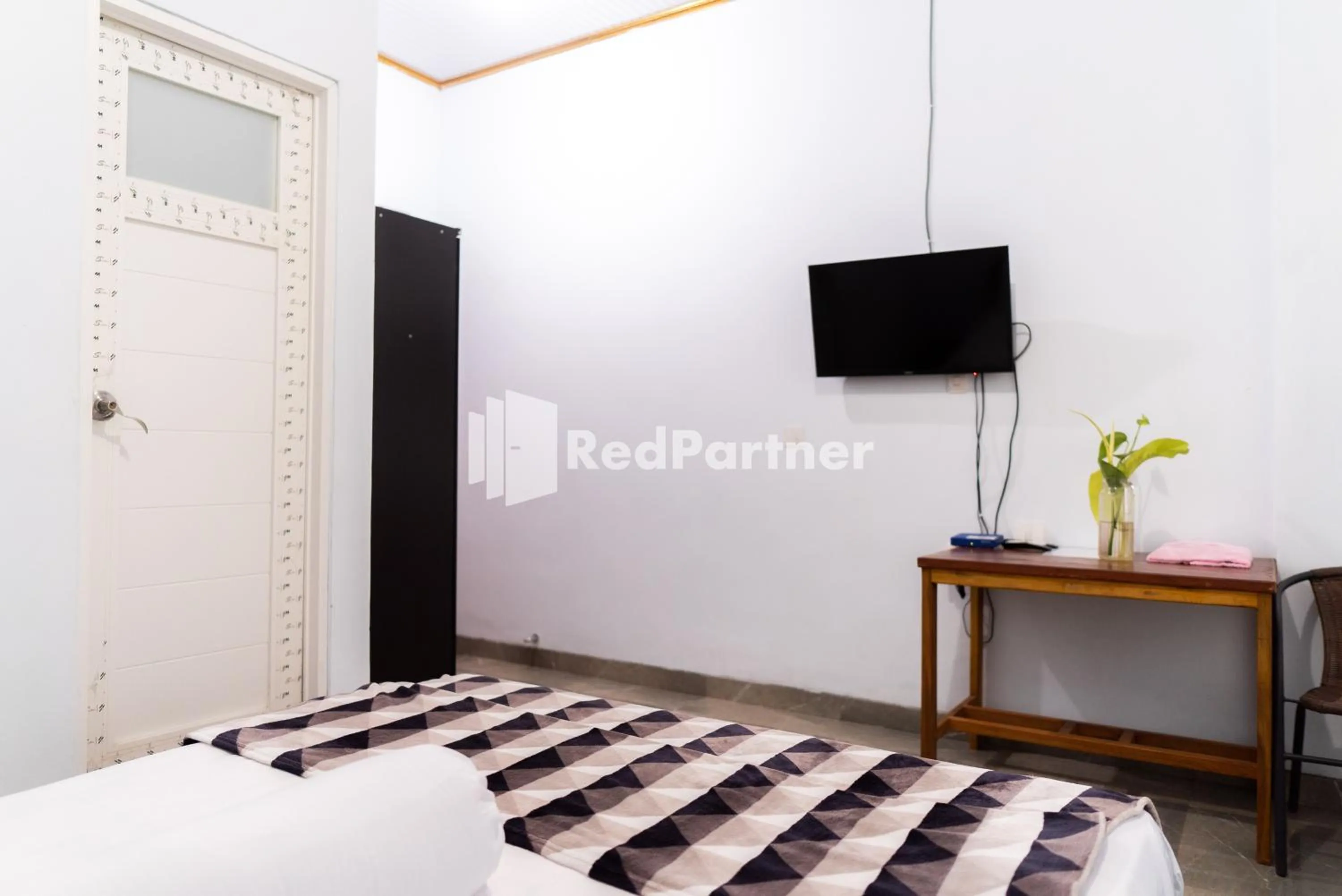 Bedroom, TV/Entertainment Center in ITR Homestay RedPartner
