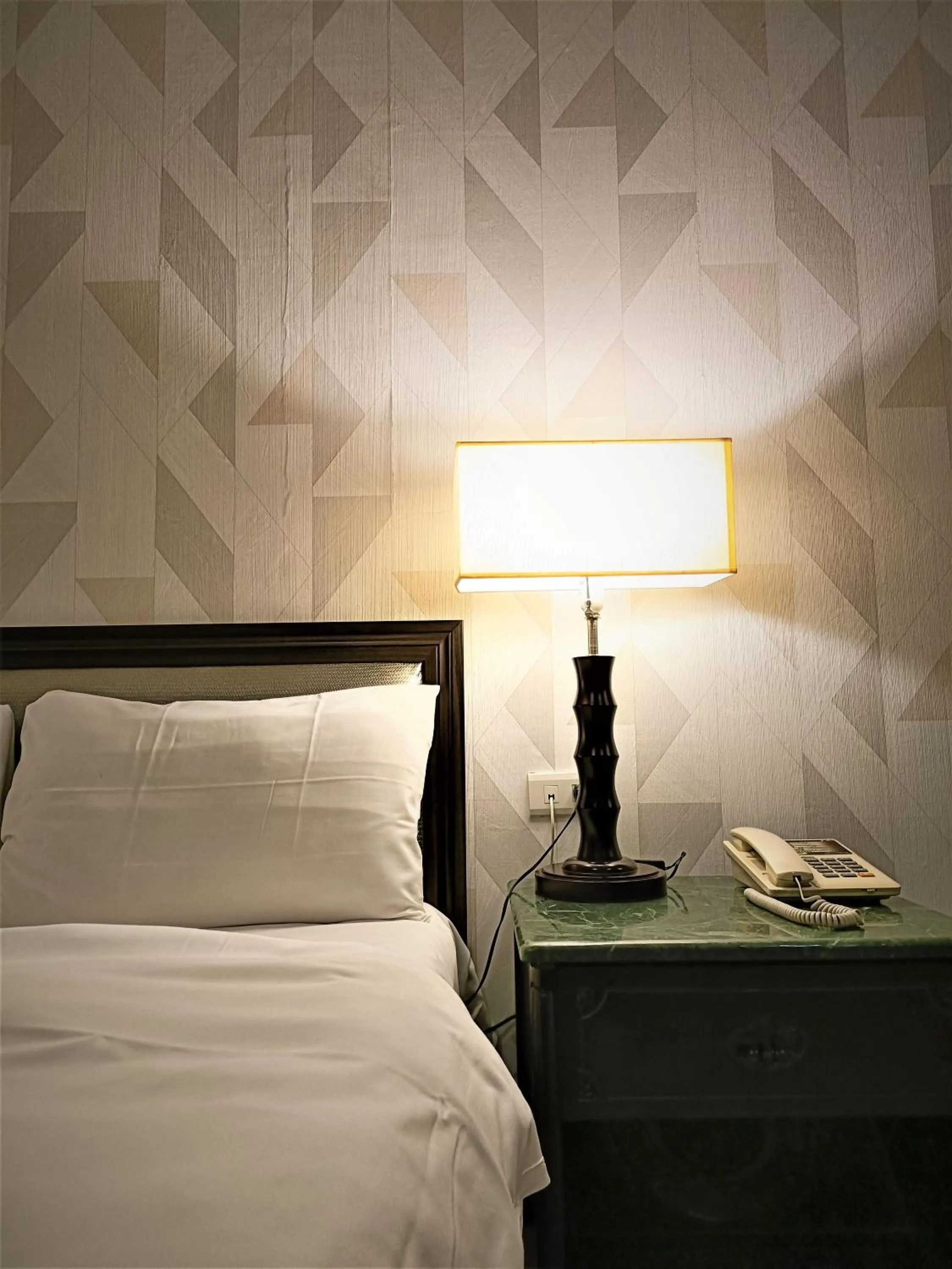 Decorative detail, Bed in Well Garden Hotel